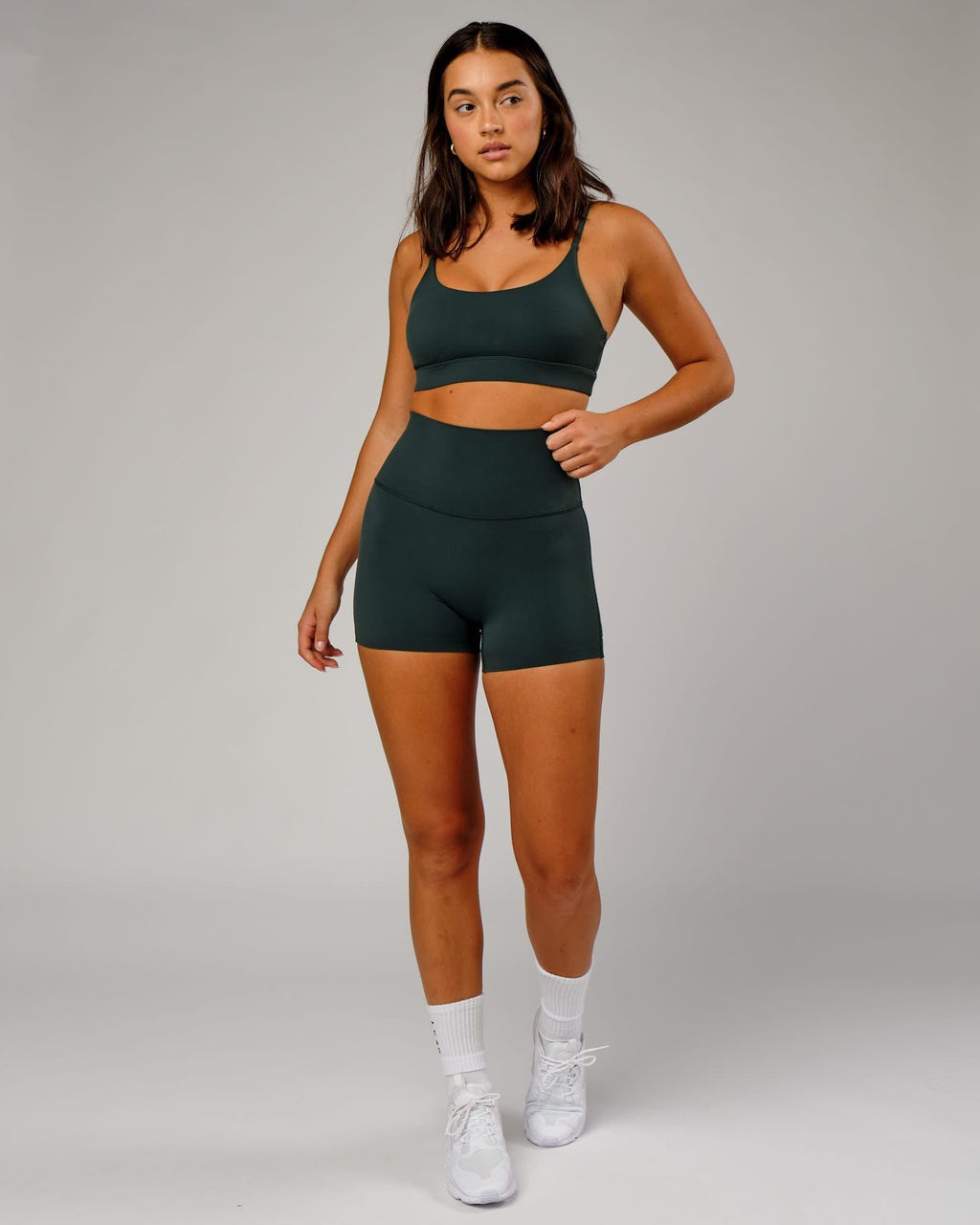 Model wearing Elixir Sports Bra - Vital Green