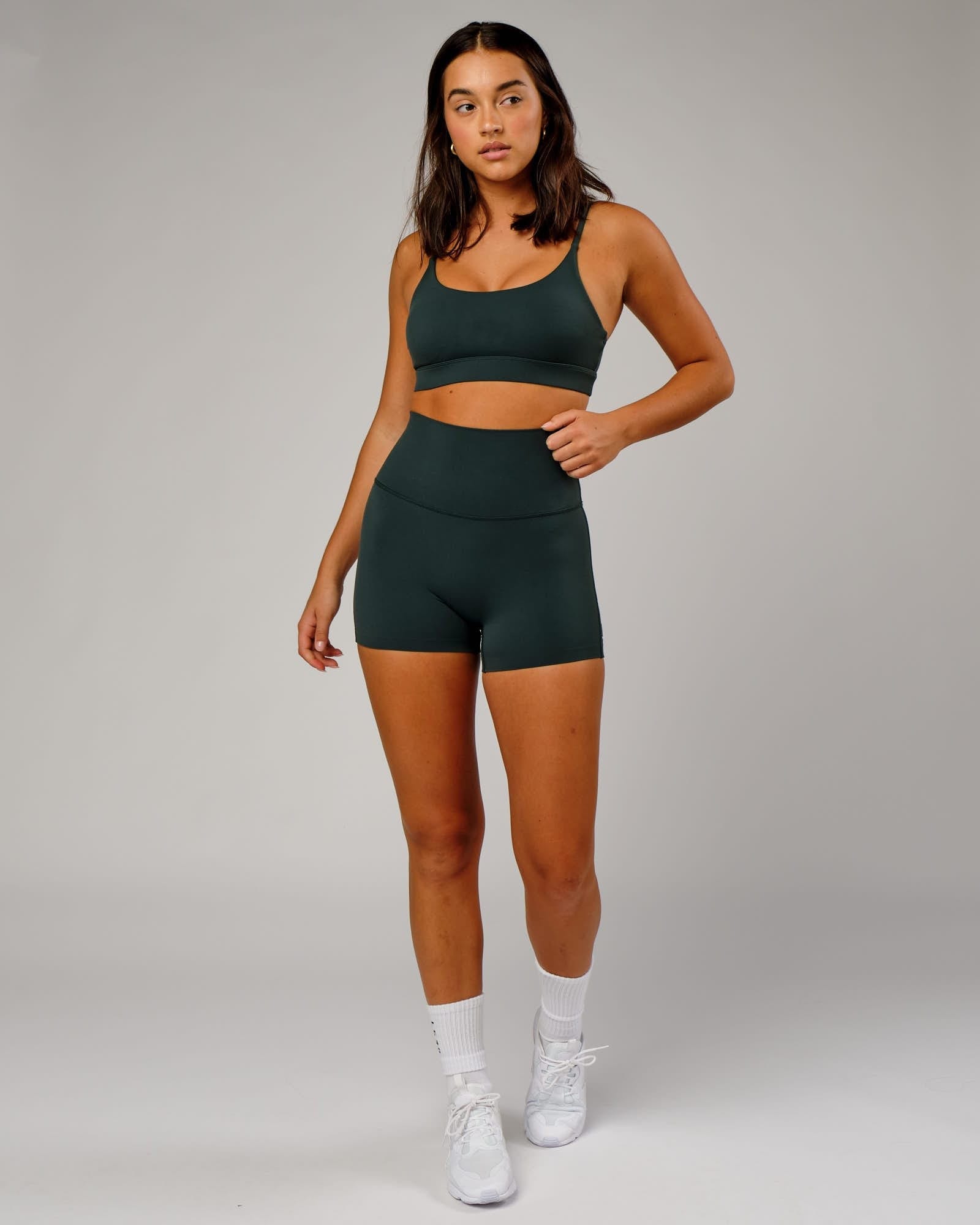 Model wearing Elixir Sports Bra - Vital Green