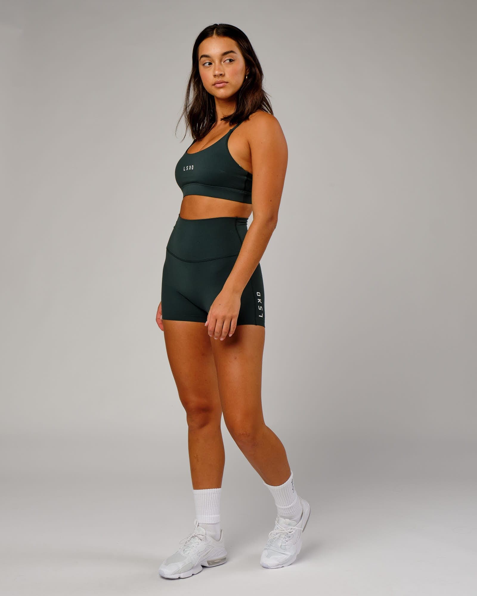 Model wearing Elixir X-Short Tight - Vital Green