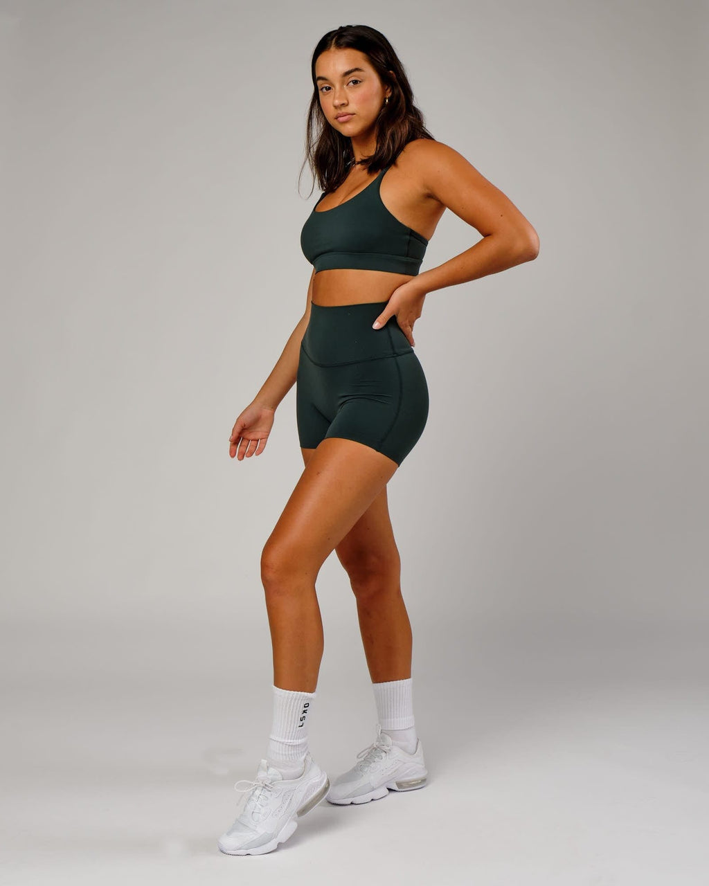 Model wearing Elixir X-Short Tight - Vital Green