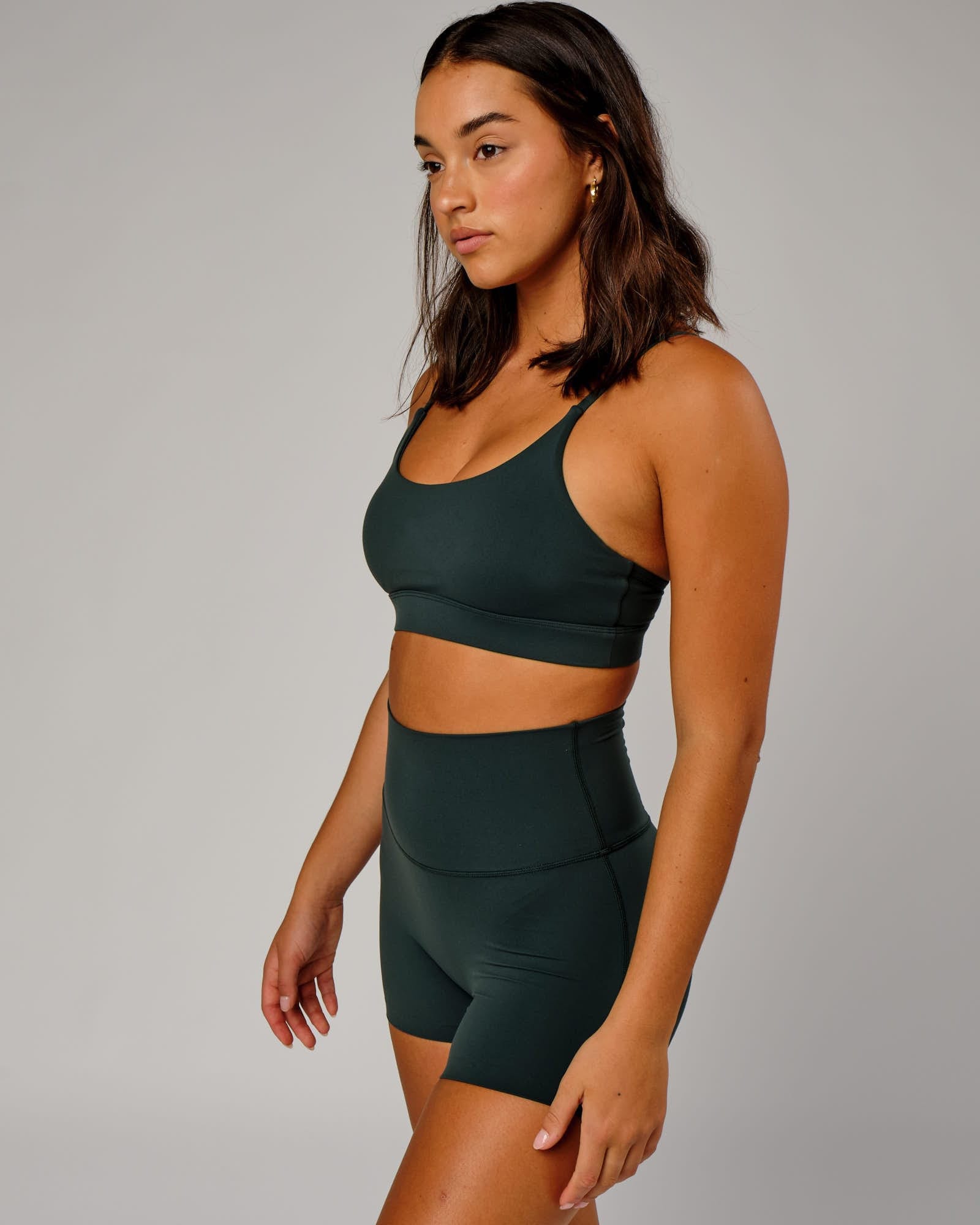 Model wearing Elixir Sports Bra - Vital Green