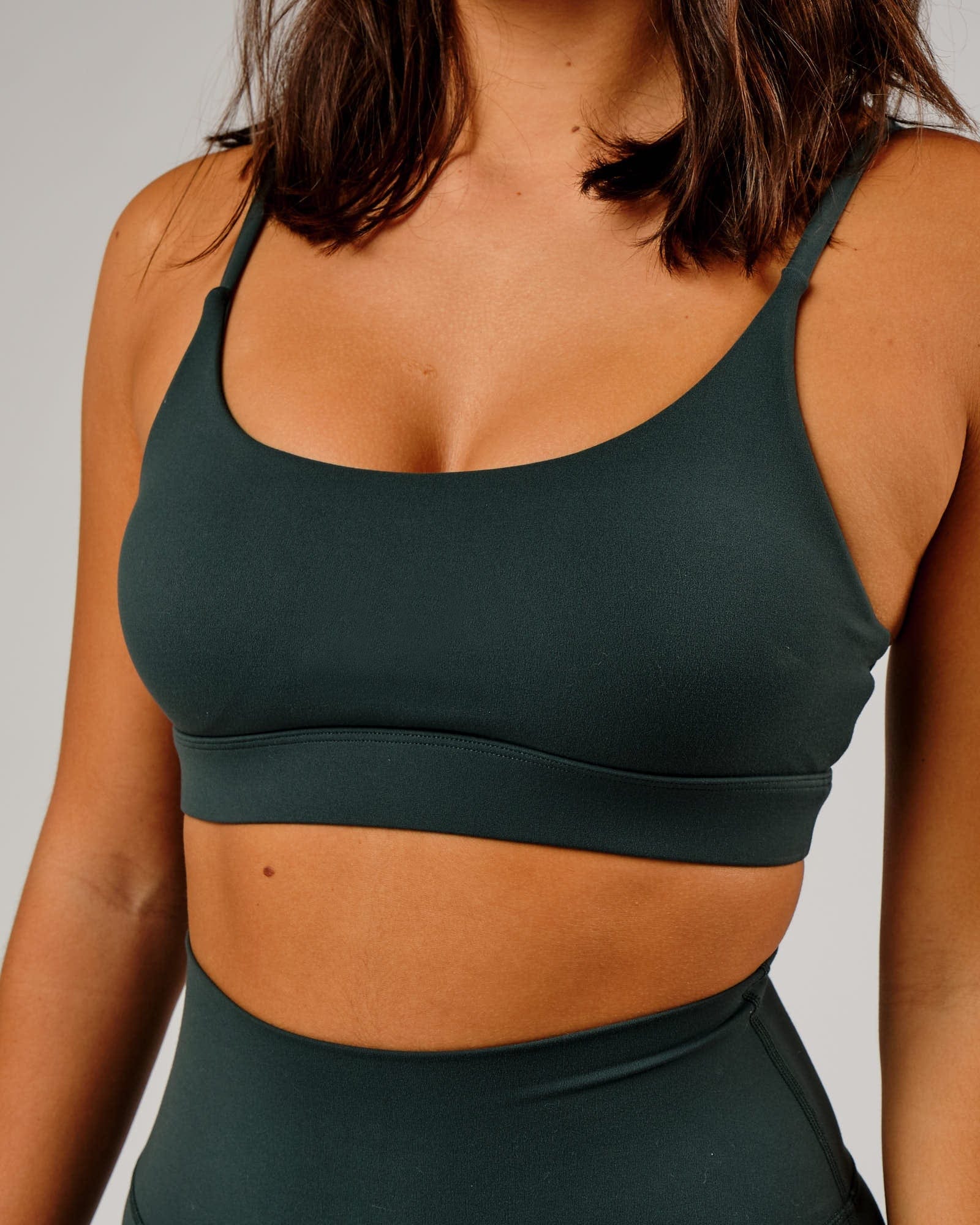 Model wearing Elixir Sports Bra - Vital Green