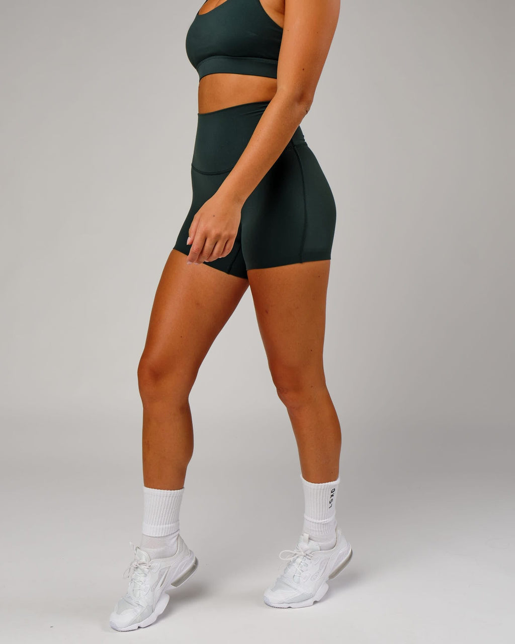 Model wearing Elixir X-Short Tight - Vital Green