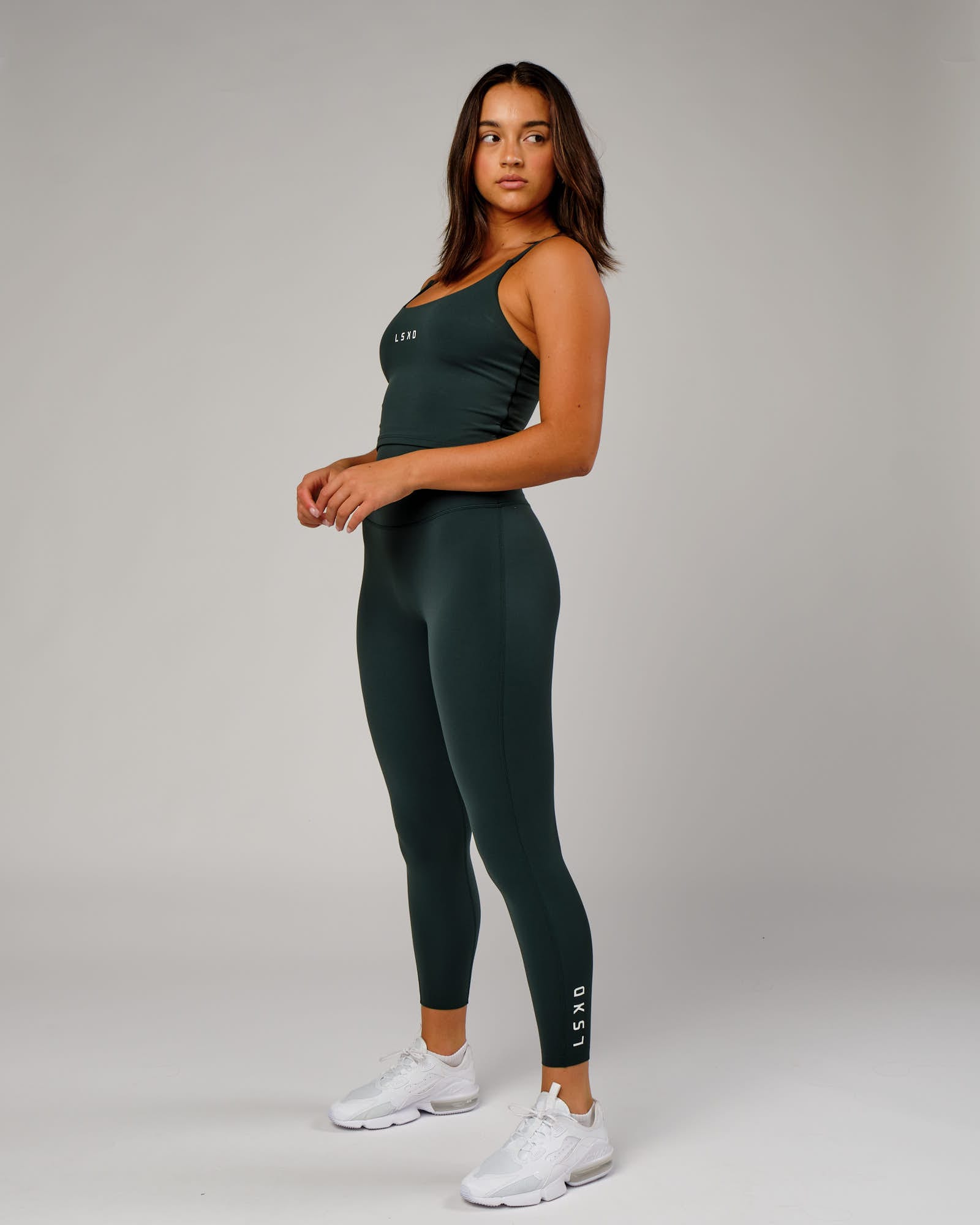 Model wearing Elixir 7/8 Length Tight - Vital Green