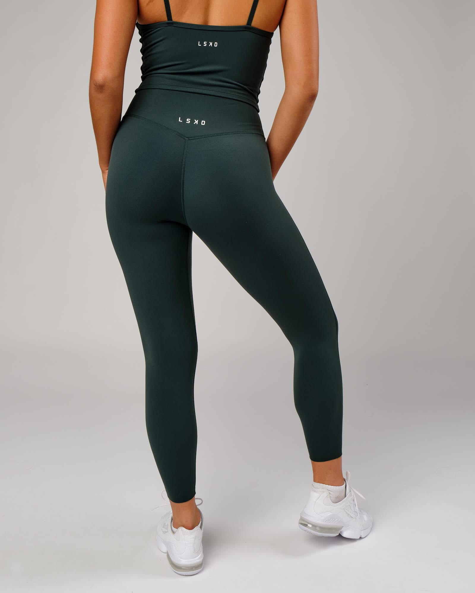 Model wearing Elixir 7/8 Length Tight - Vital Green