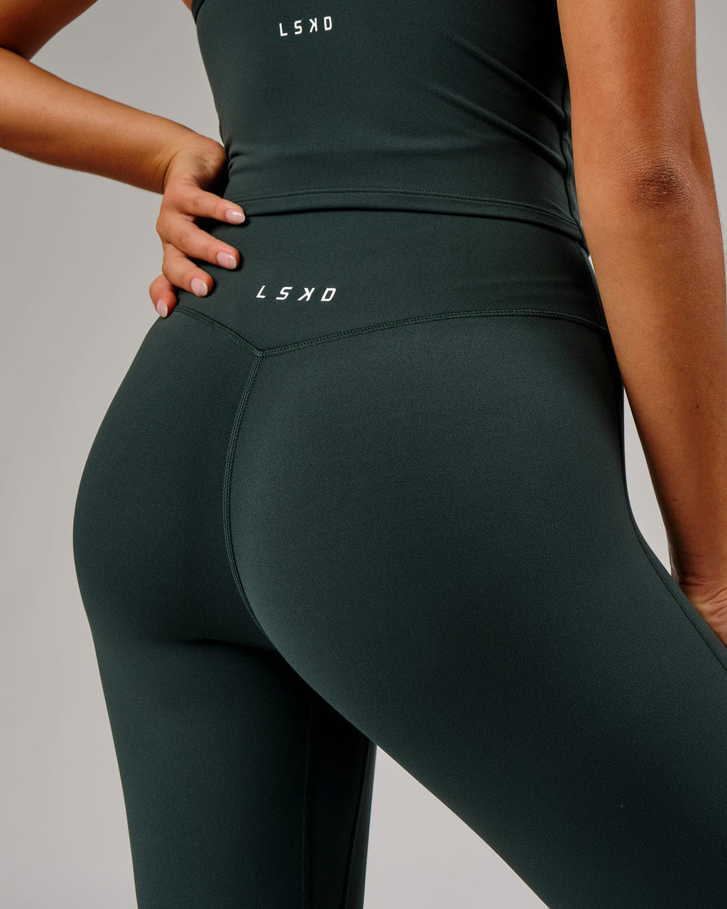 Model wearing Elixir 7/8 Length Tight - Vital Green