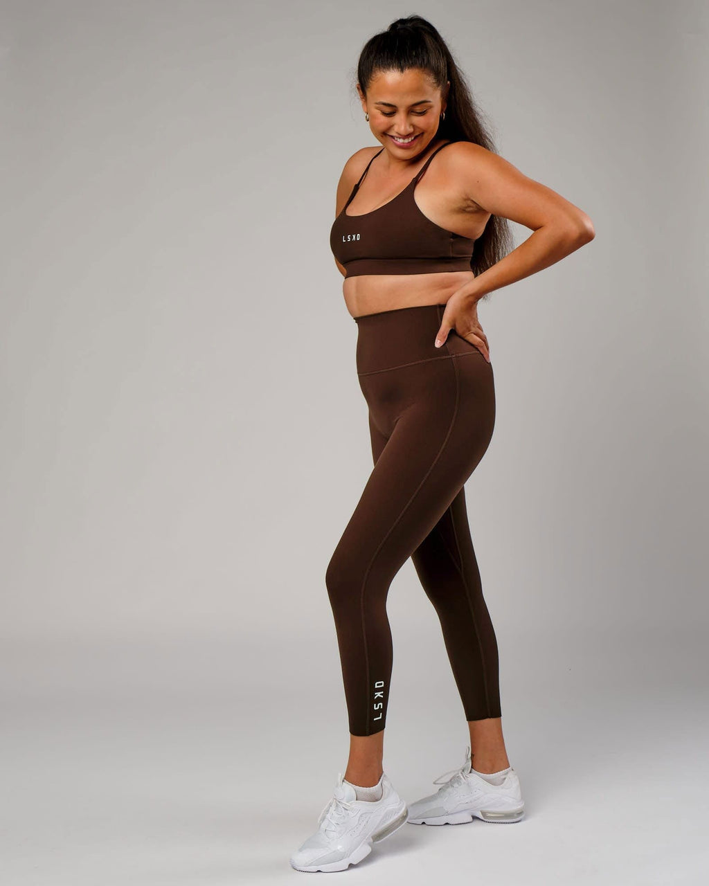 Model wearing Elixir 7/8 Length Tight - Chocolate