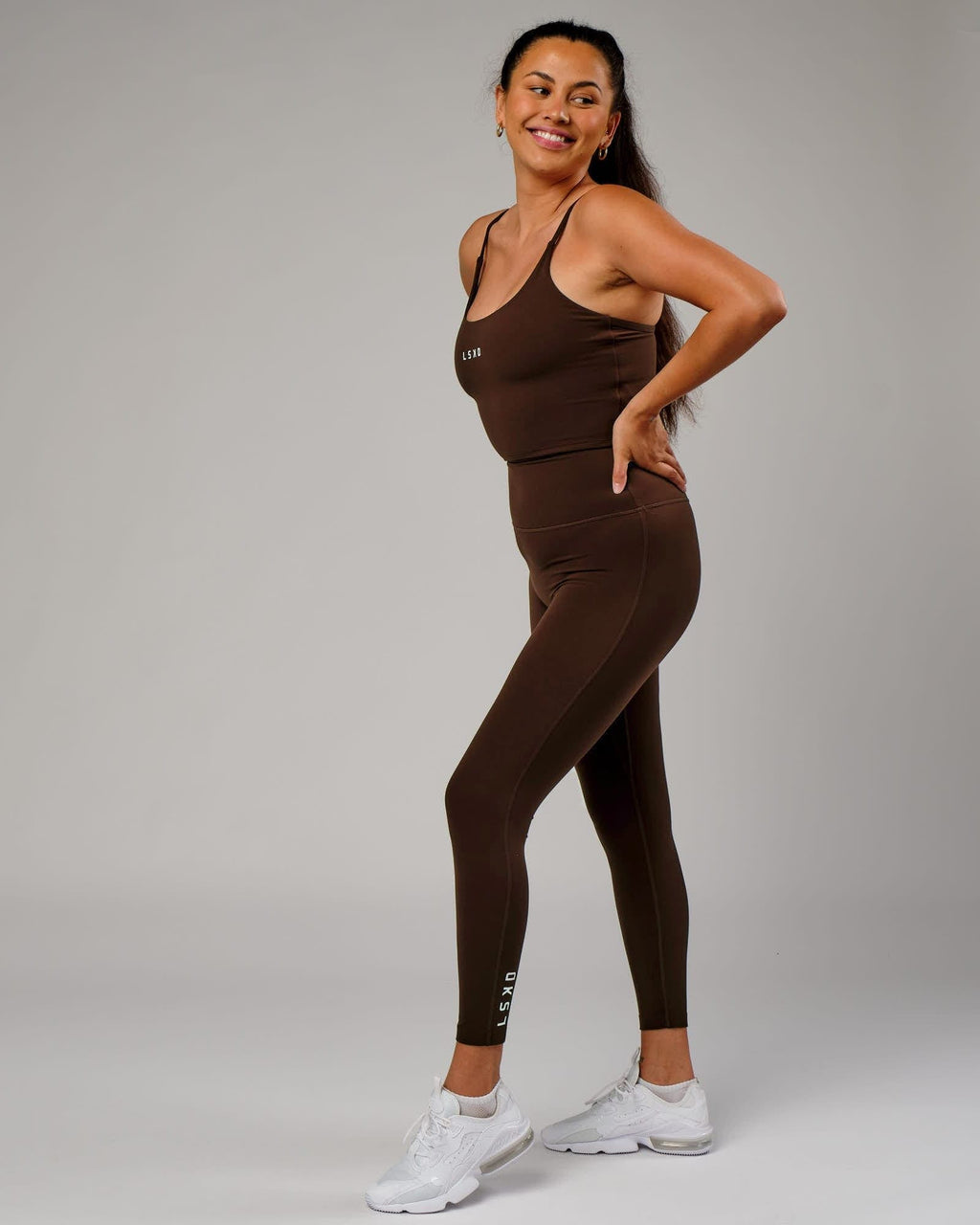 Model wearing Elixir Full Length Tight - Chocolate