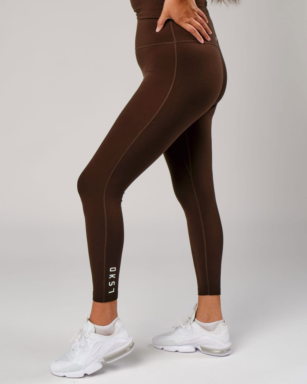 Model wearing Elixir Full Length Tight - Chocolate
