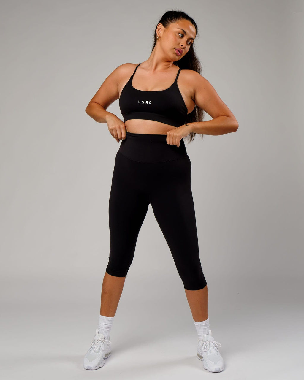 Model wearing Elixir 3/4 Length Tight - Black