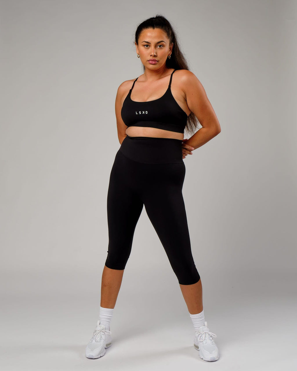 Model wearing Elixir 3/4 Length Tight - Black