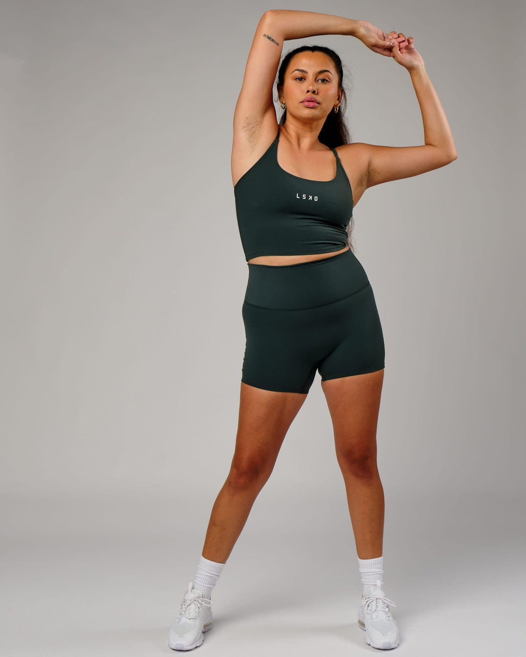 Model wearing Elixir X-Short Tight - Vital Green