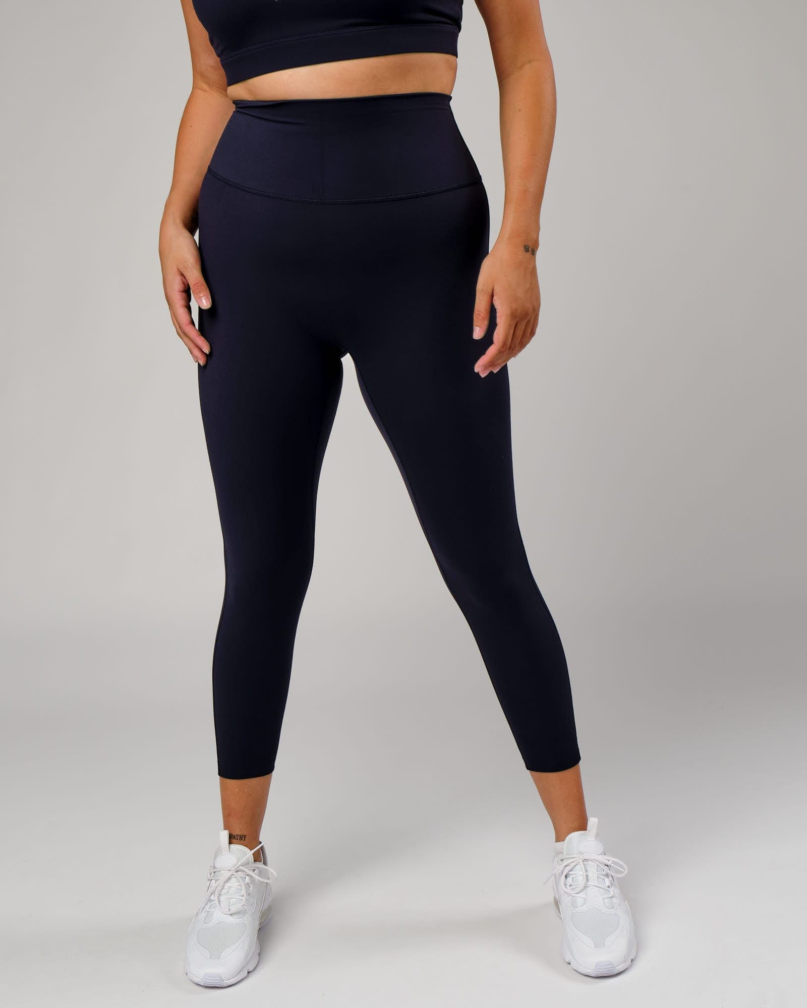 Model wearing Elixir 7/8 Length Tight - Navy