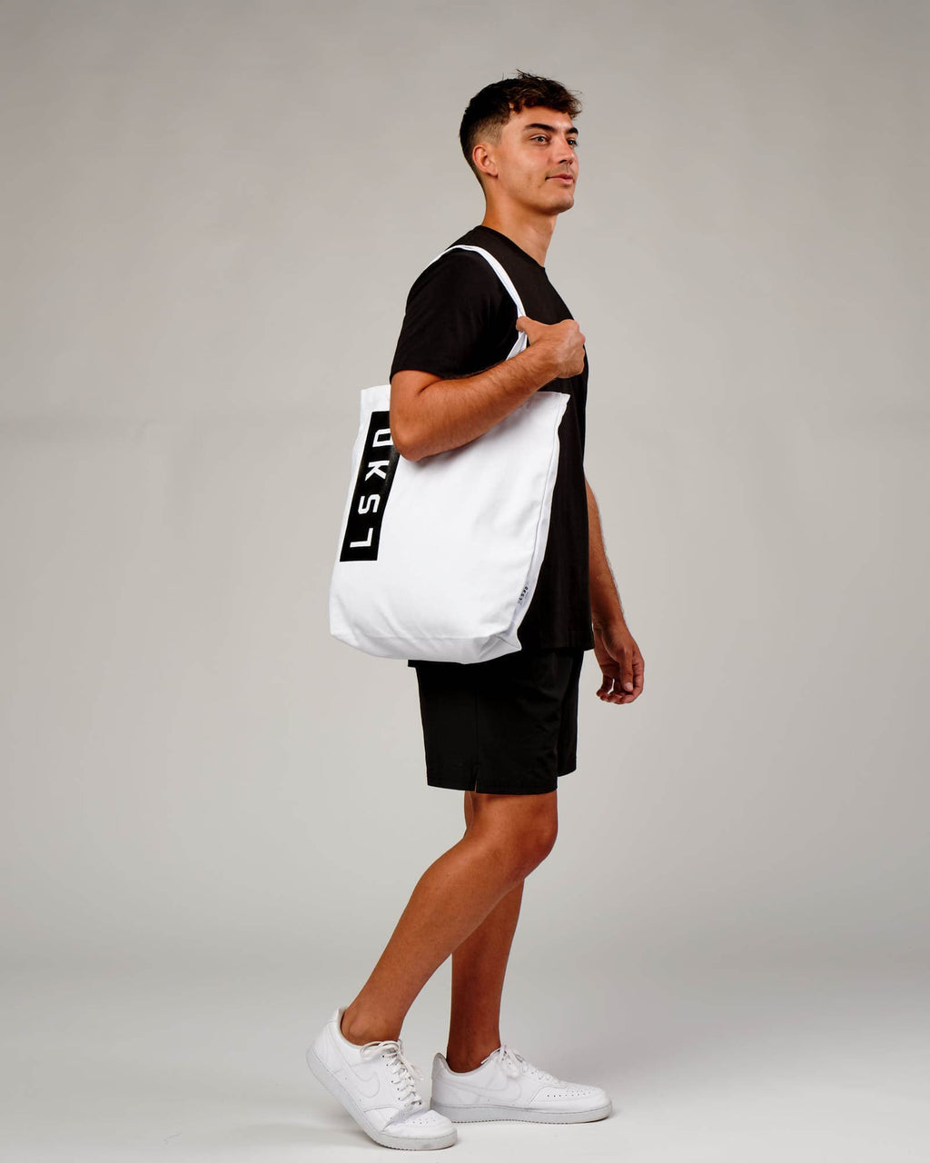 Model wearing Limits Tote Bag - White