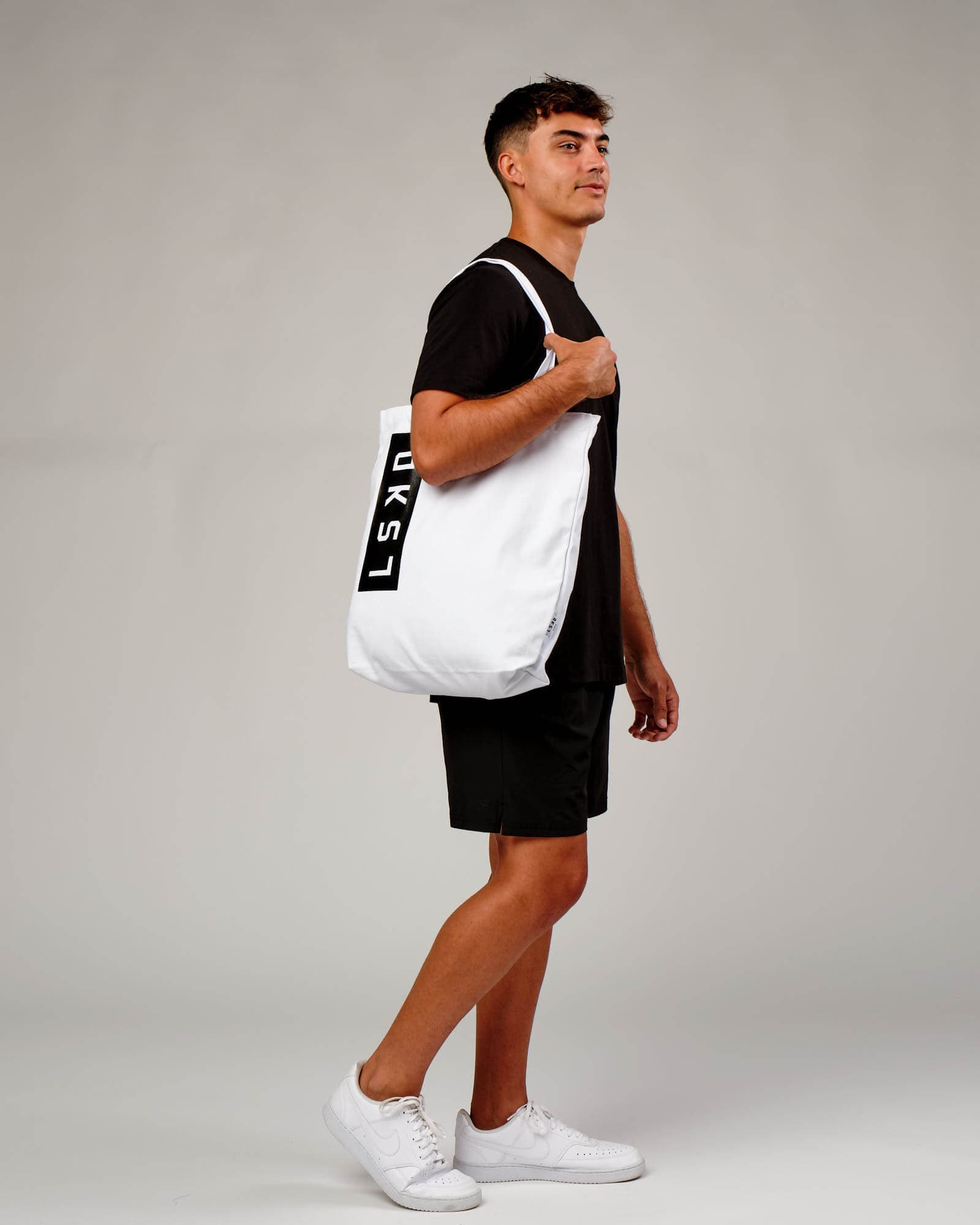 Model wearing Limits Tote Bag - White