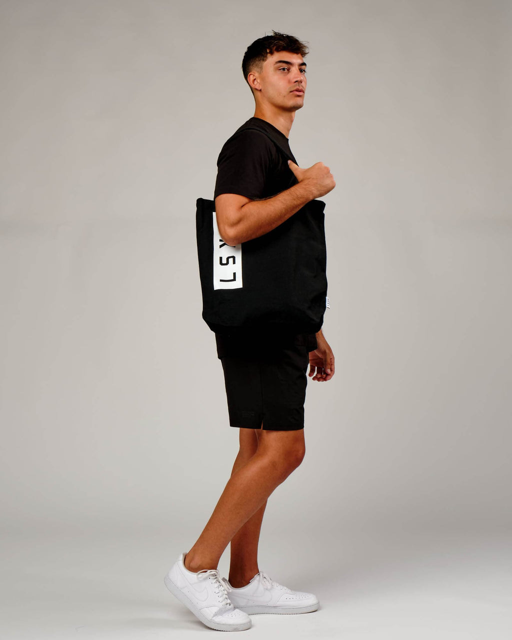 Model wearing Limits Tote Bag - Black