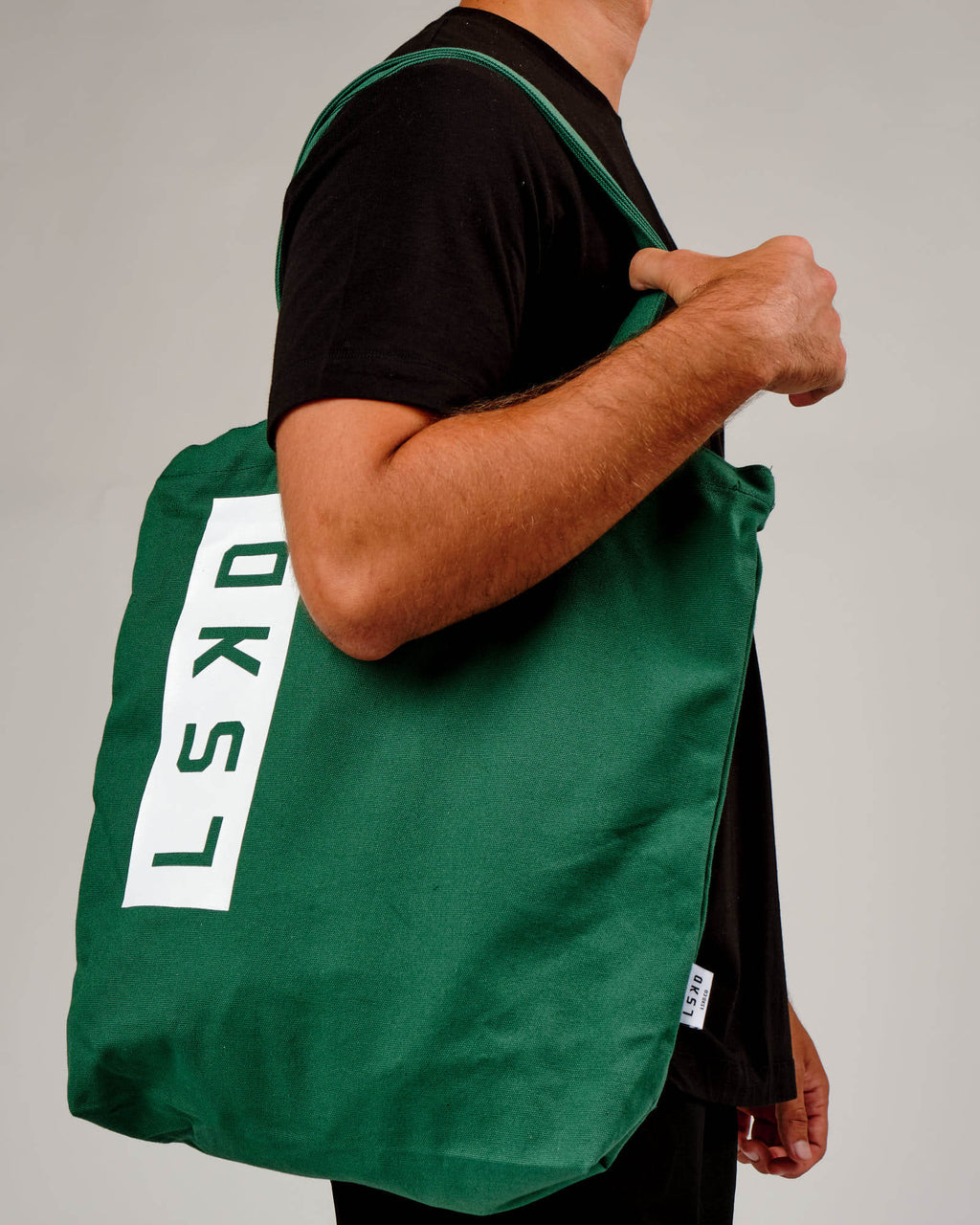 Model wearing Limits Tote Bag - Pine Green