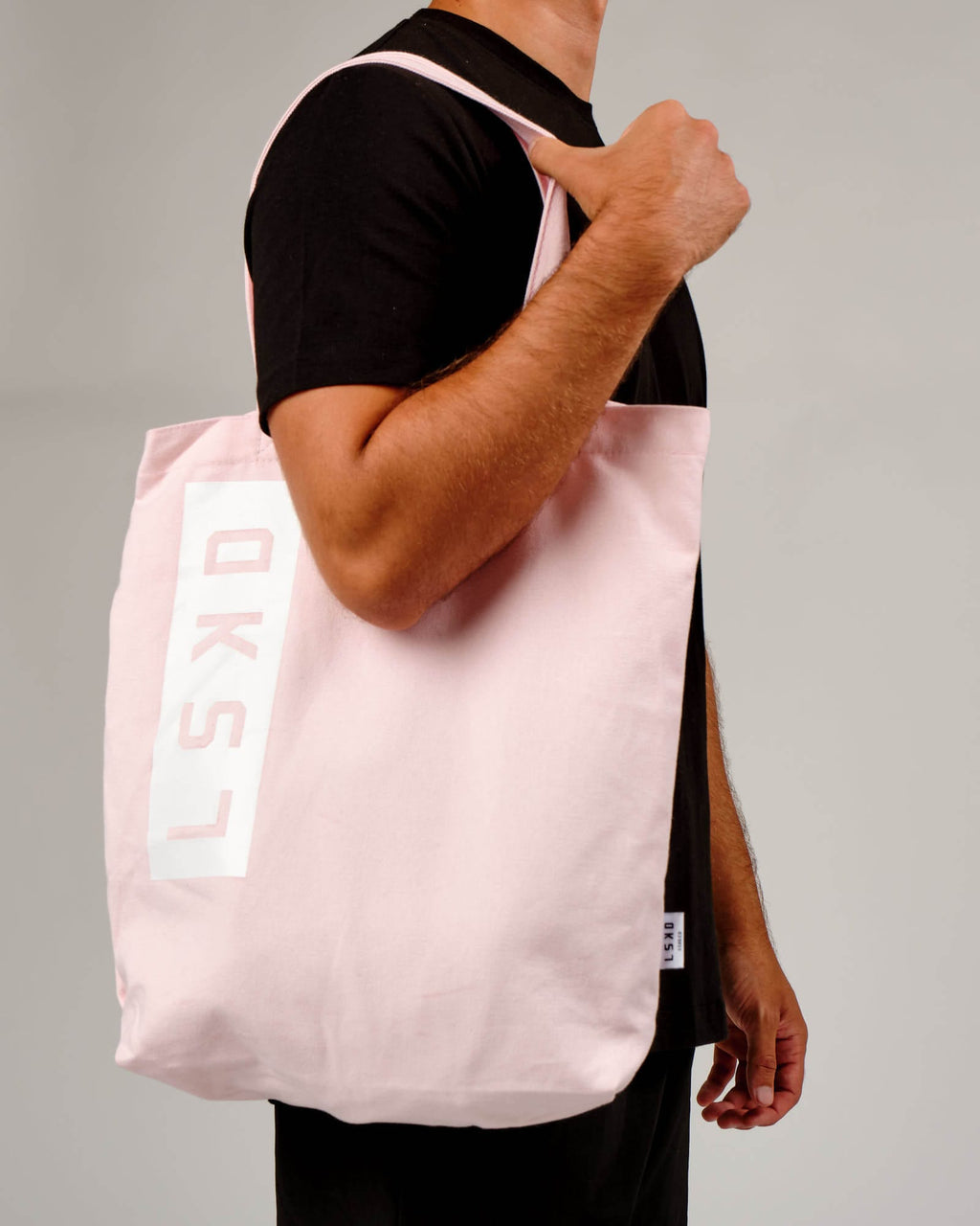 Model wearing Limits Tote Bag - Powder Pink