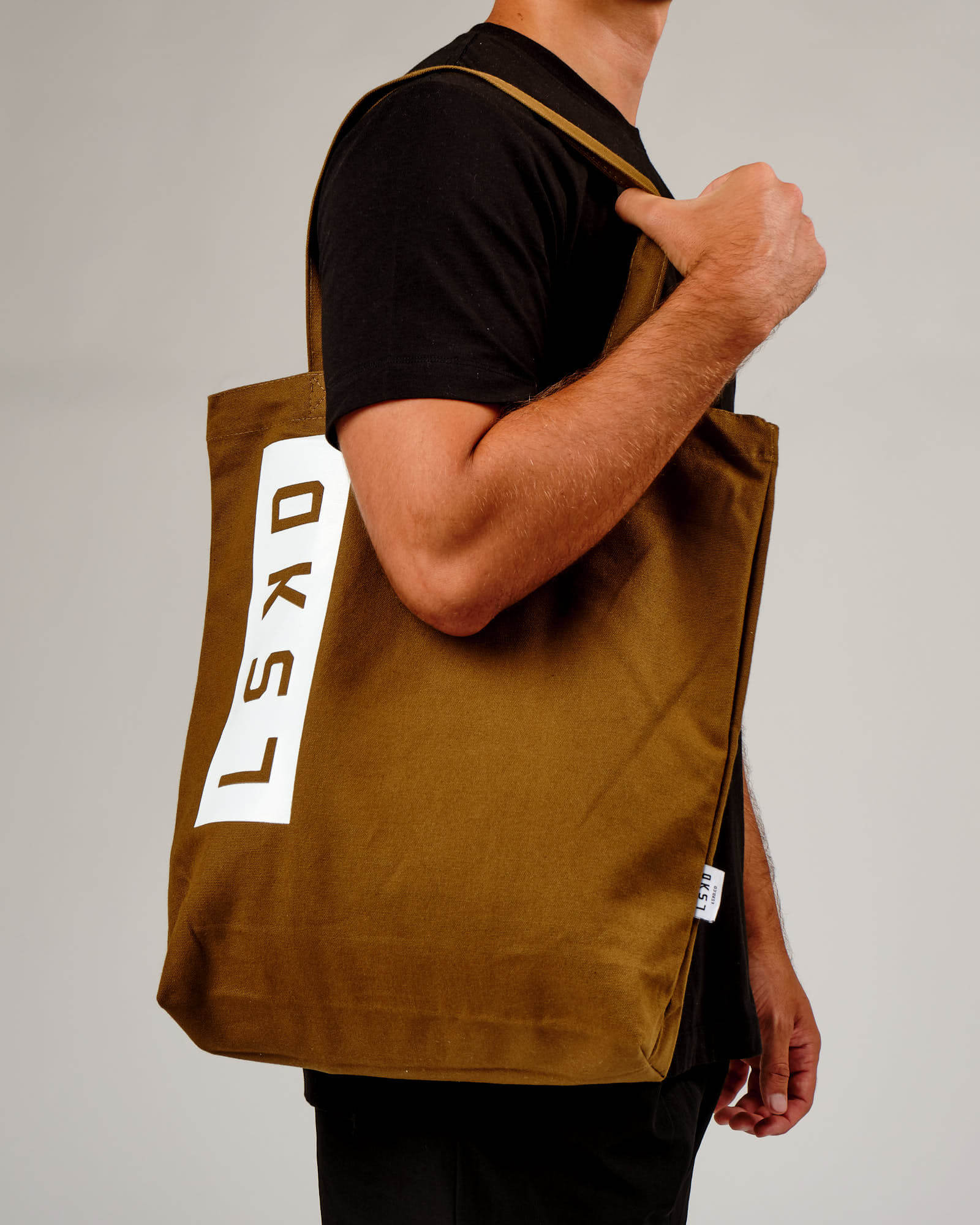 Model wearing Limits Tote Bag - Mocha