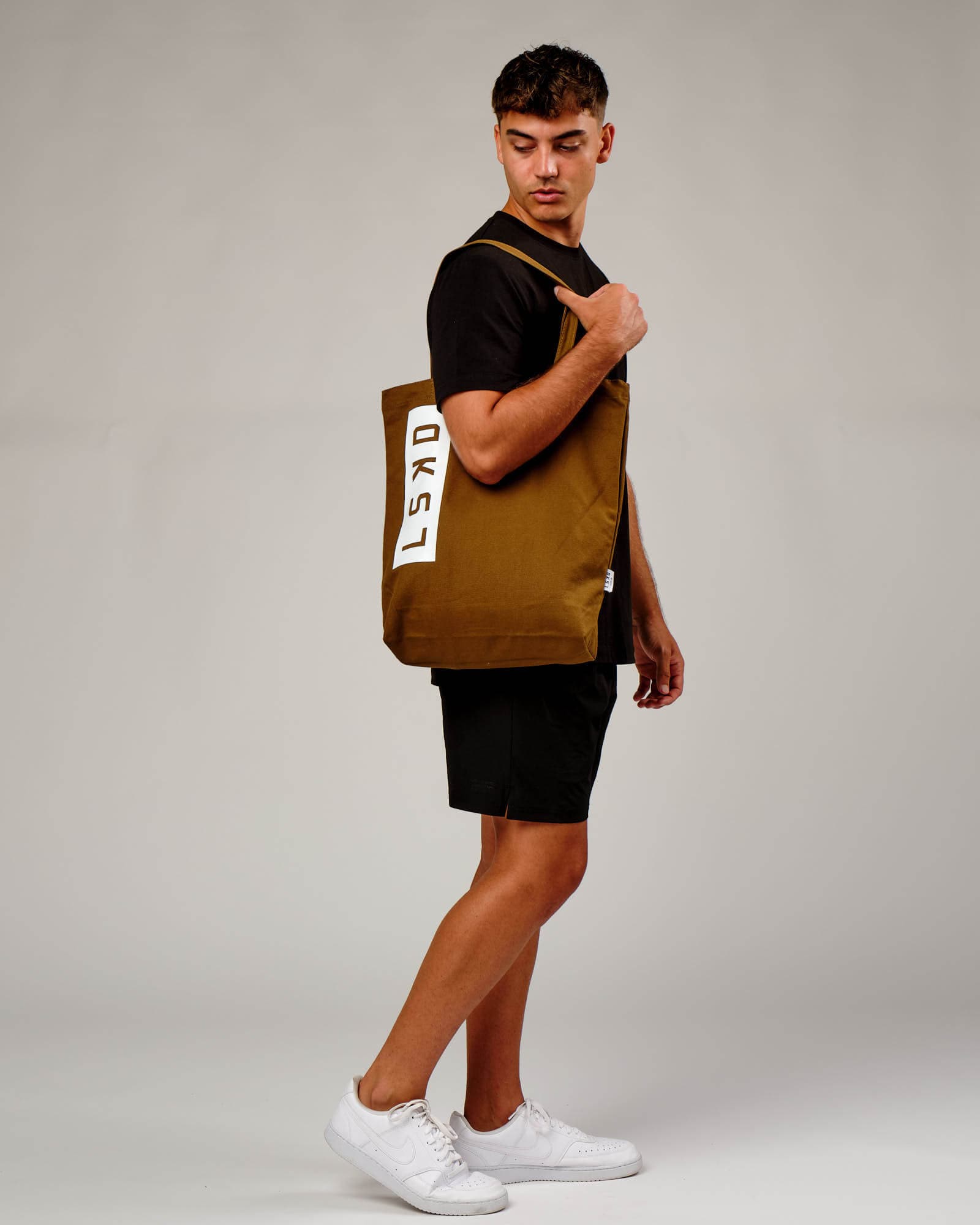 Model wearing Limits Tote Bag - Mocha
