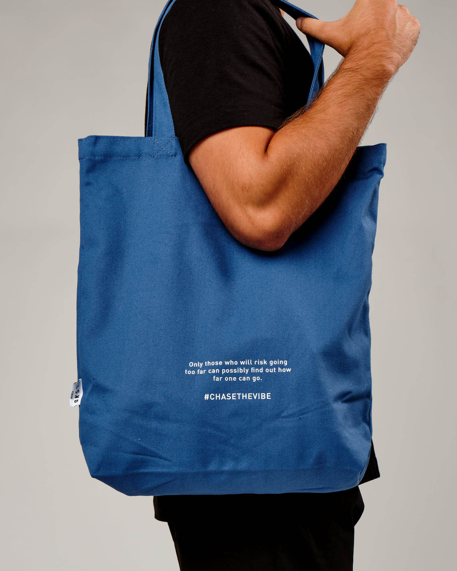Model wearing Limits Tote Bag - Dusty Cobalt