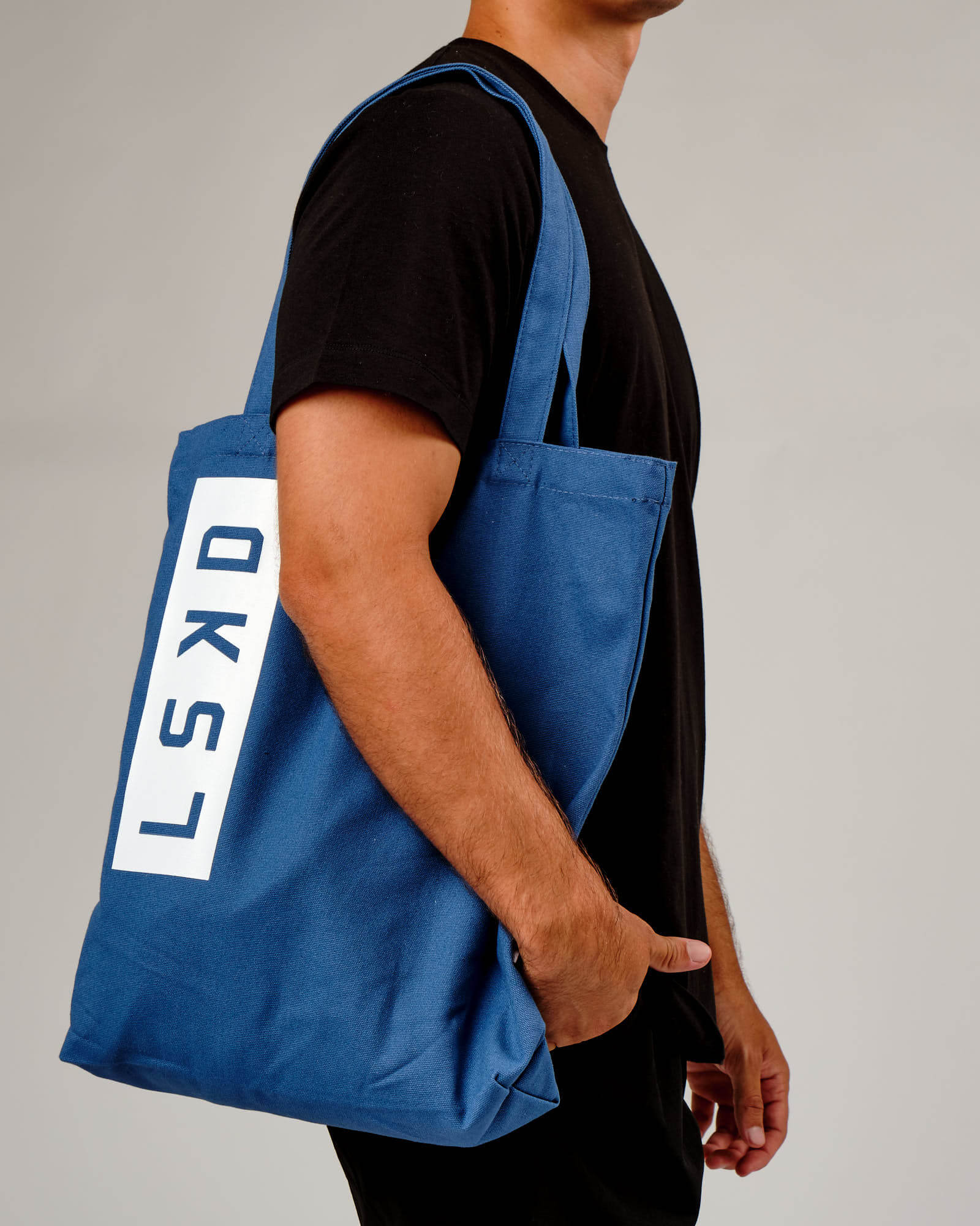 Model wearing Limits Tote Bag - Dusty Cobalt