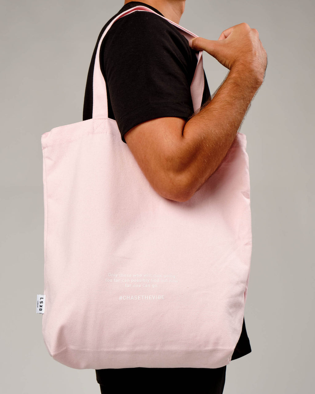 Model wearing Limits Tote Bag - Powder Pink