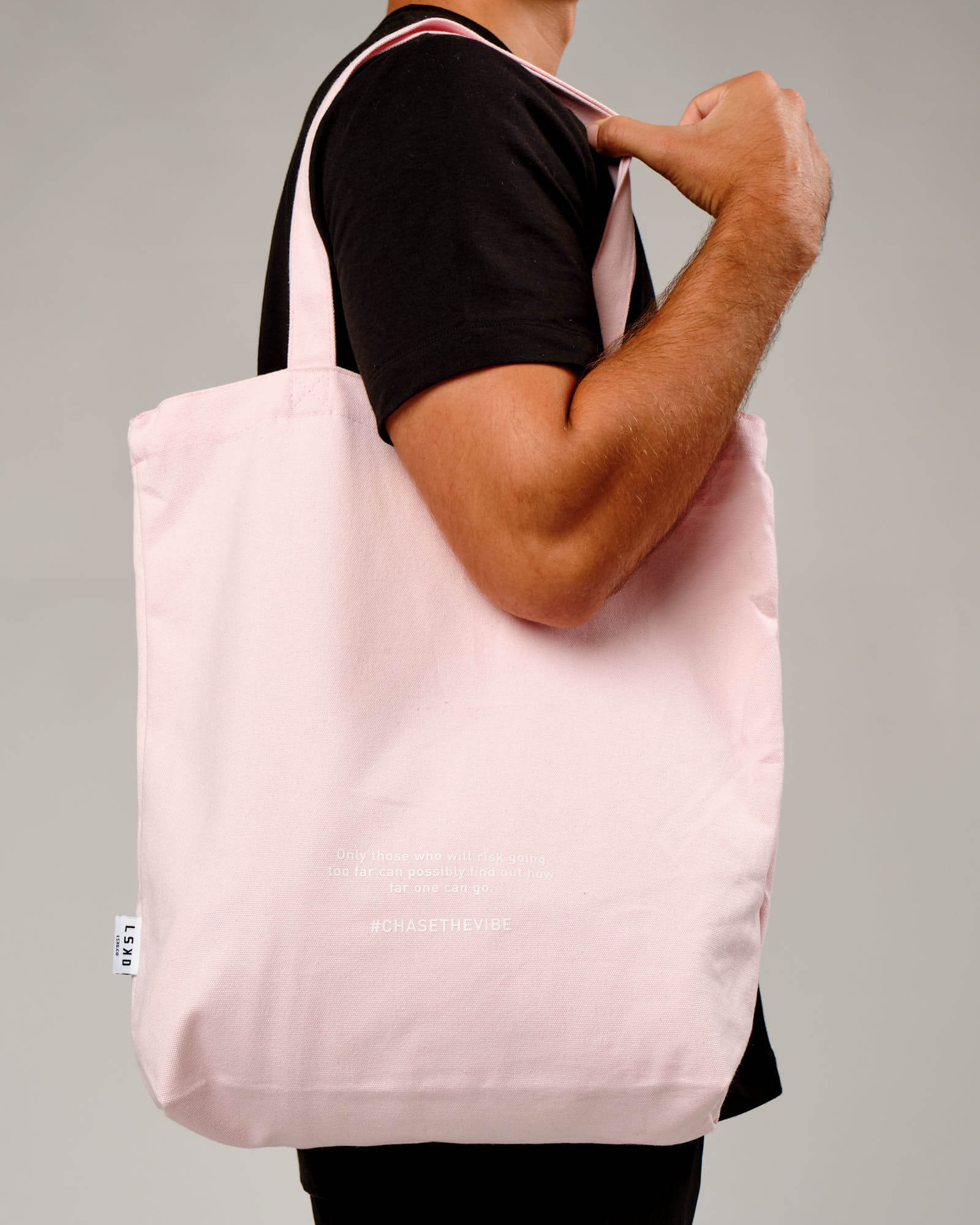 Model wearing Limits Tote Bag - Powder Pink
