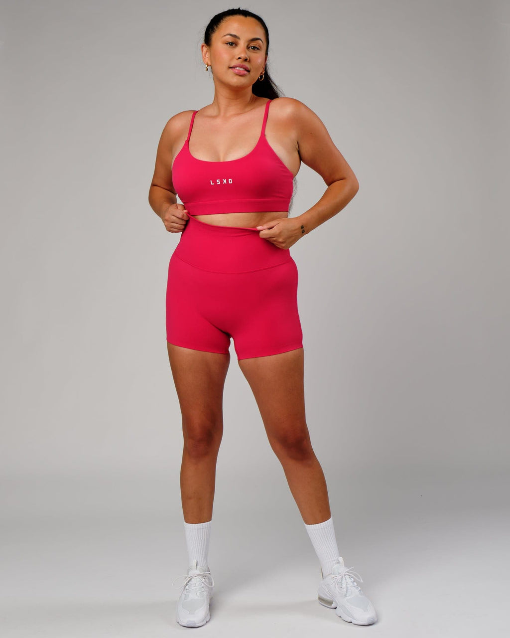 Model wearing Elixir X-Short Tight - Boysenberry