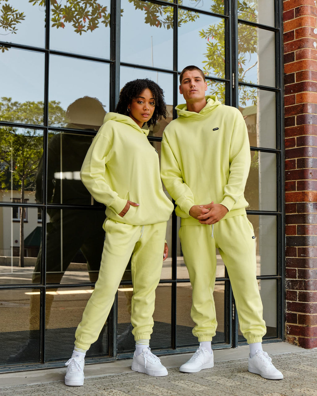 Model wearing Unisex Capsule Track Pant - Pastel Lime