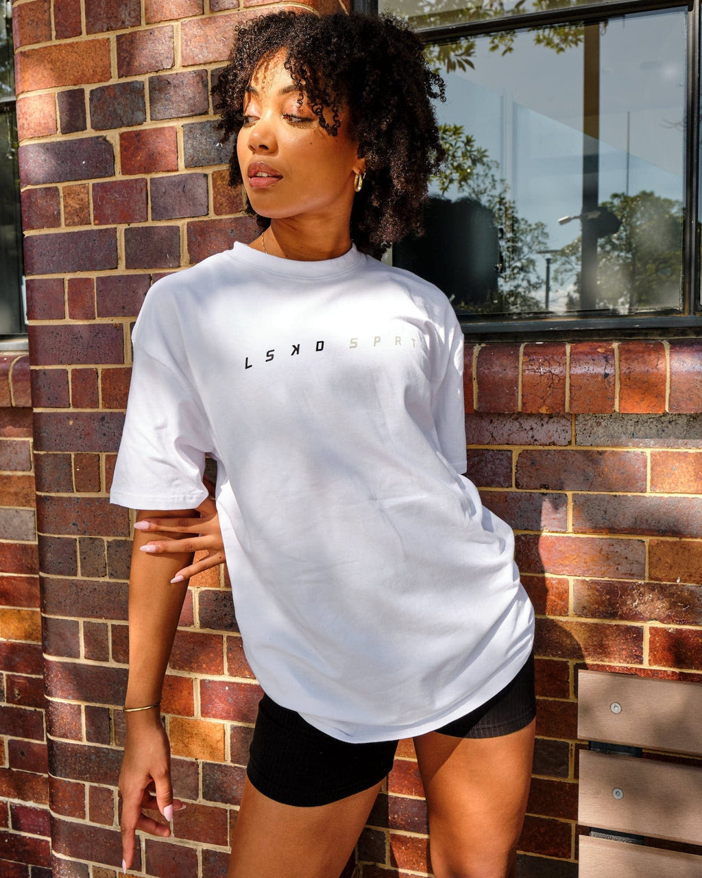 Model wearing Speedster Tee - White