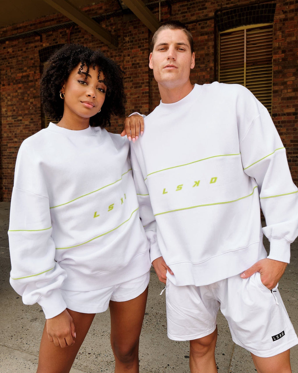 Model wearing Unisex Ascent Oversized Sweater - White-Fluro Lime