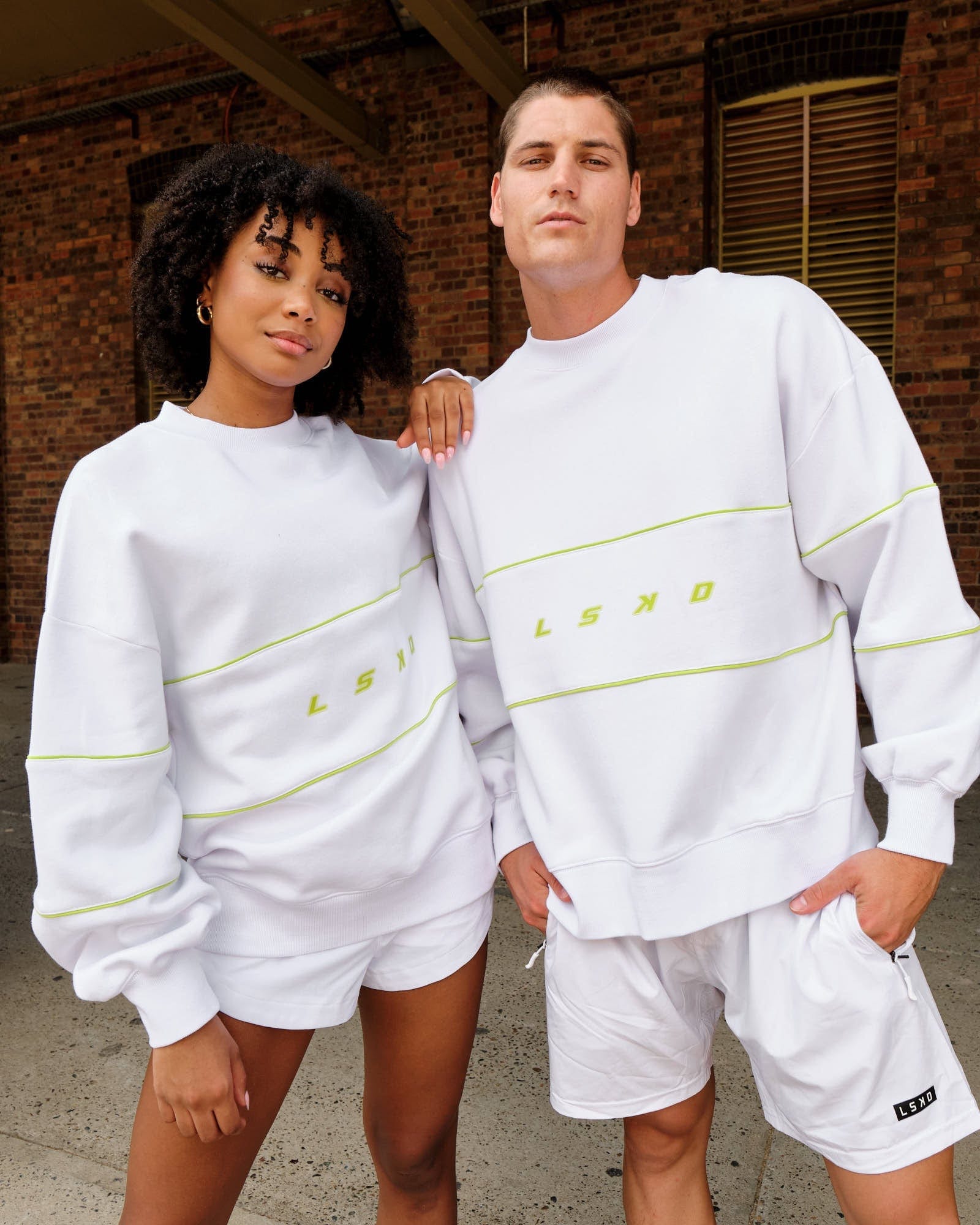 Model wearing Unisex Ascent Oversized Sweater - White-Fluro Lime