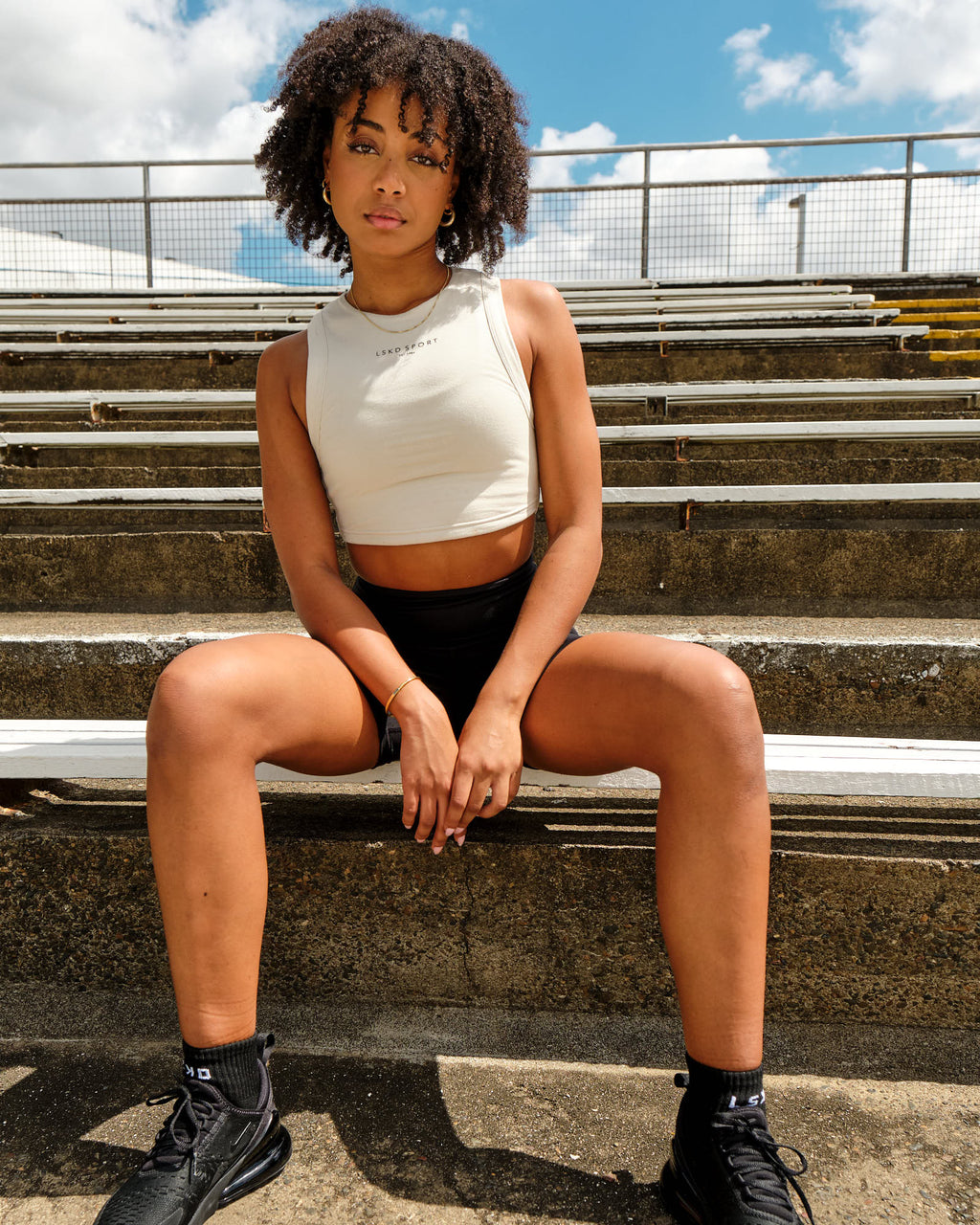 Model wearing Run Tank - Bone