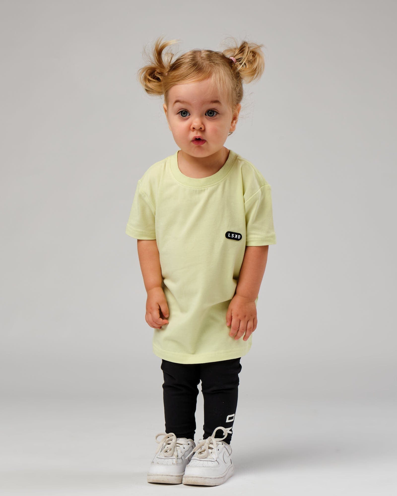Model wearing Capsule Tee (00-8) - Pastel Lime