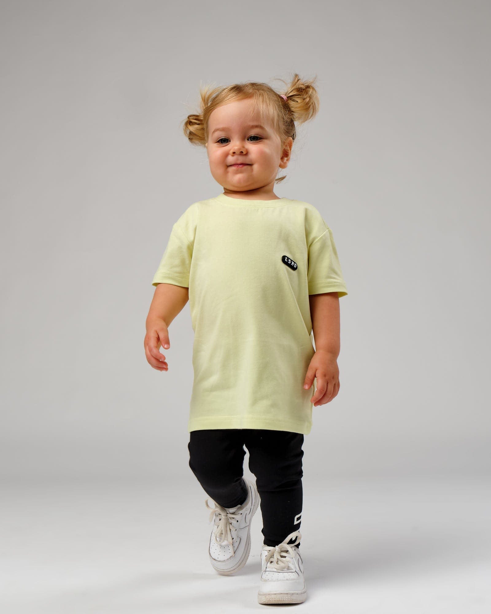 Model wearing Capsule Tee (00-8) - Pastel Lime