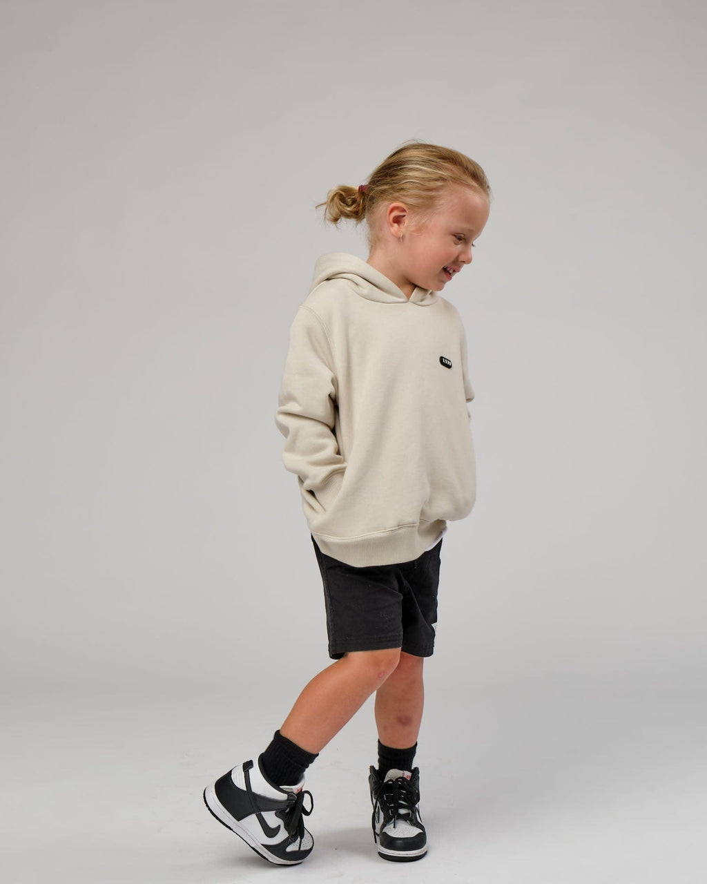 Model wearing Capsule Hoodie (00-8) - Bone