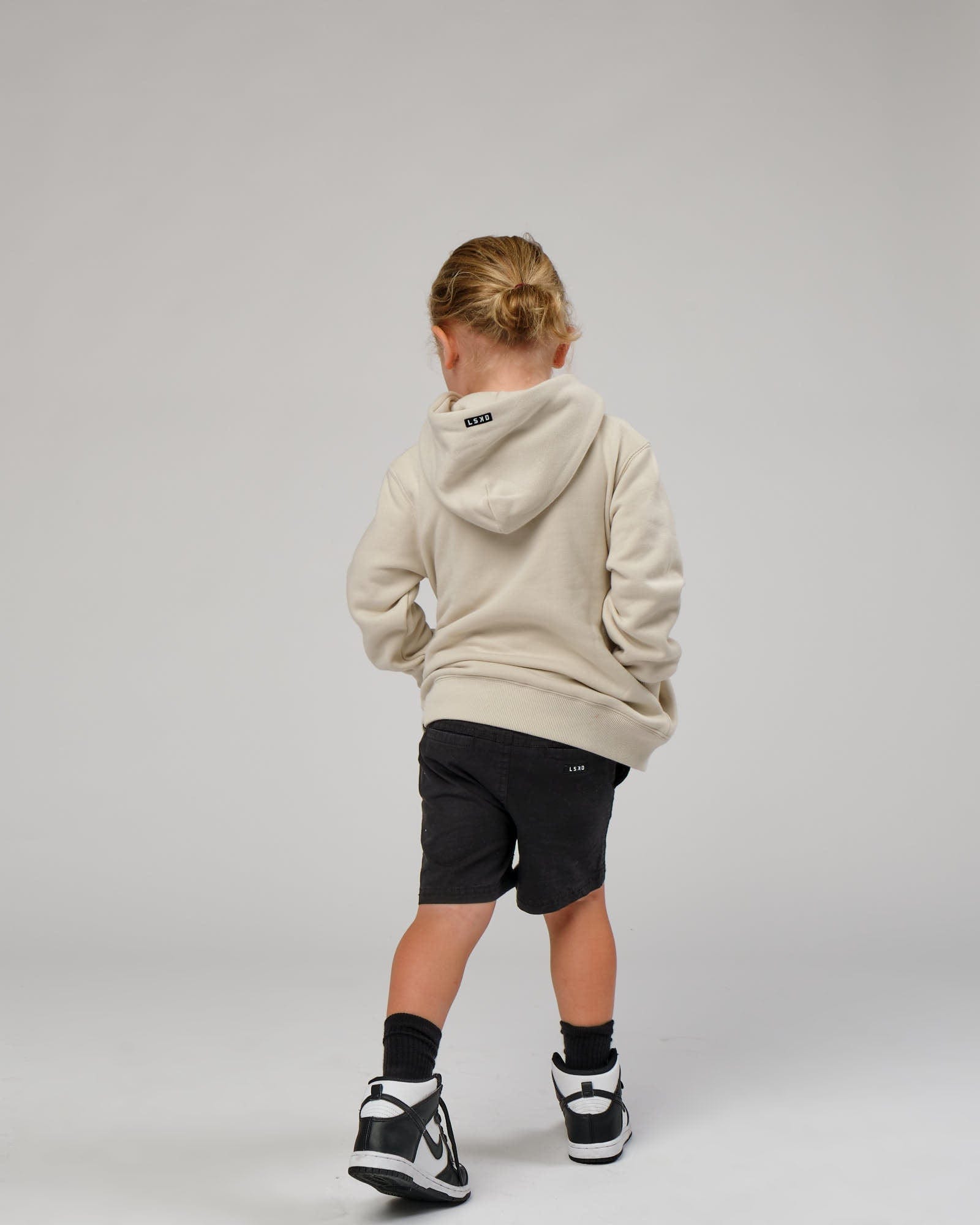 Model wearing Capsule Hoodie (00-8) - Bone