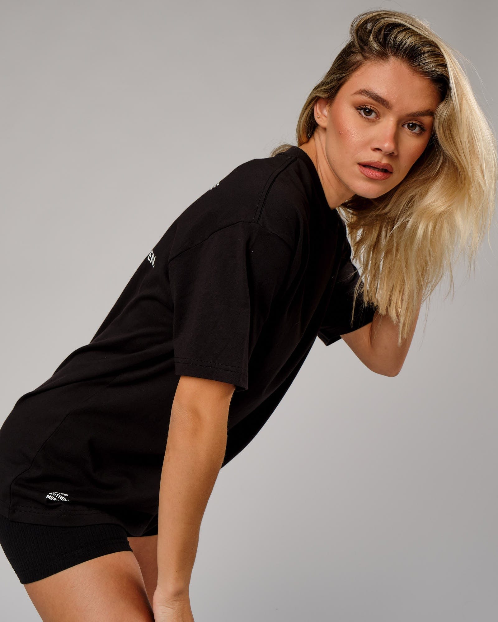 Model wearing Unisex OGTC Tee Oversize - Black