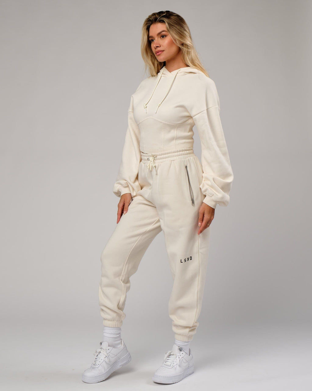 Model wearing Becca Track Pant - Cream