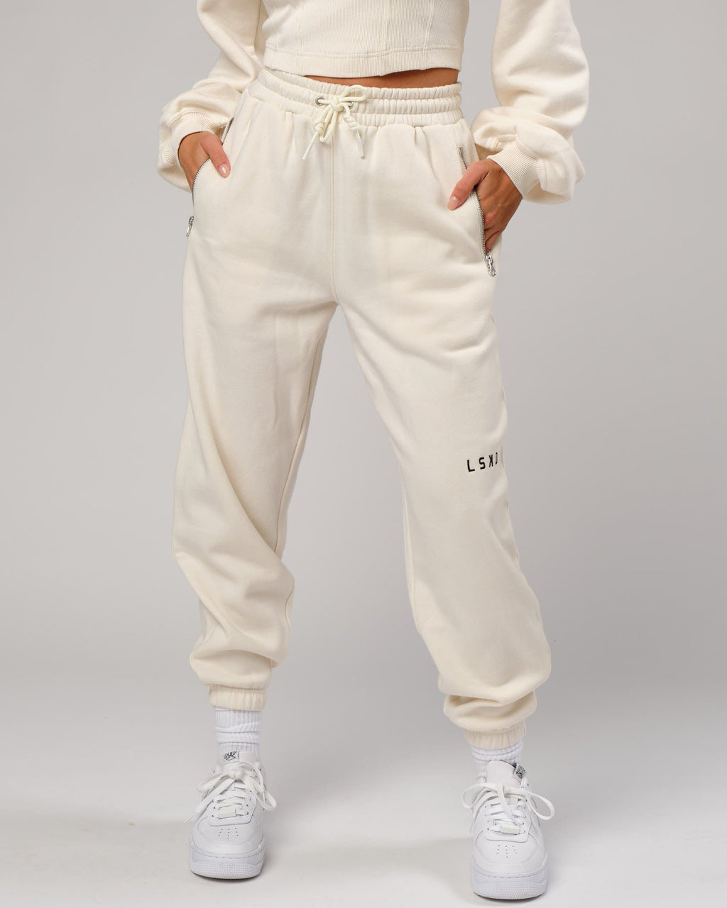 Model wearing Becca Track Pant - Cream