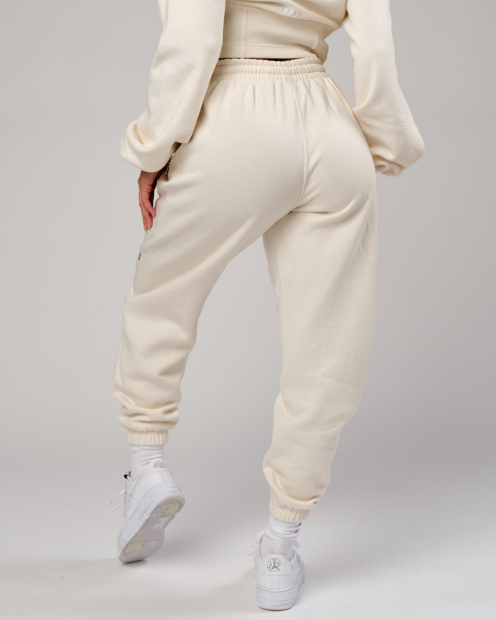 Model wearing Becca Track Pant - Cream