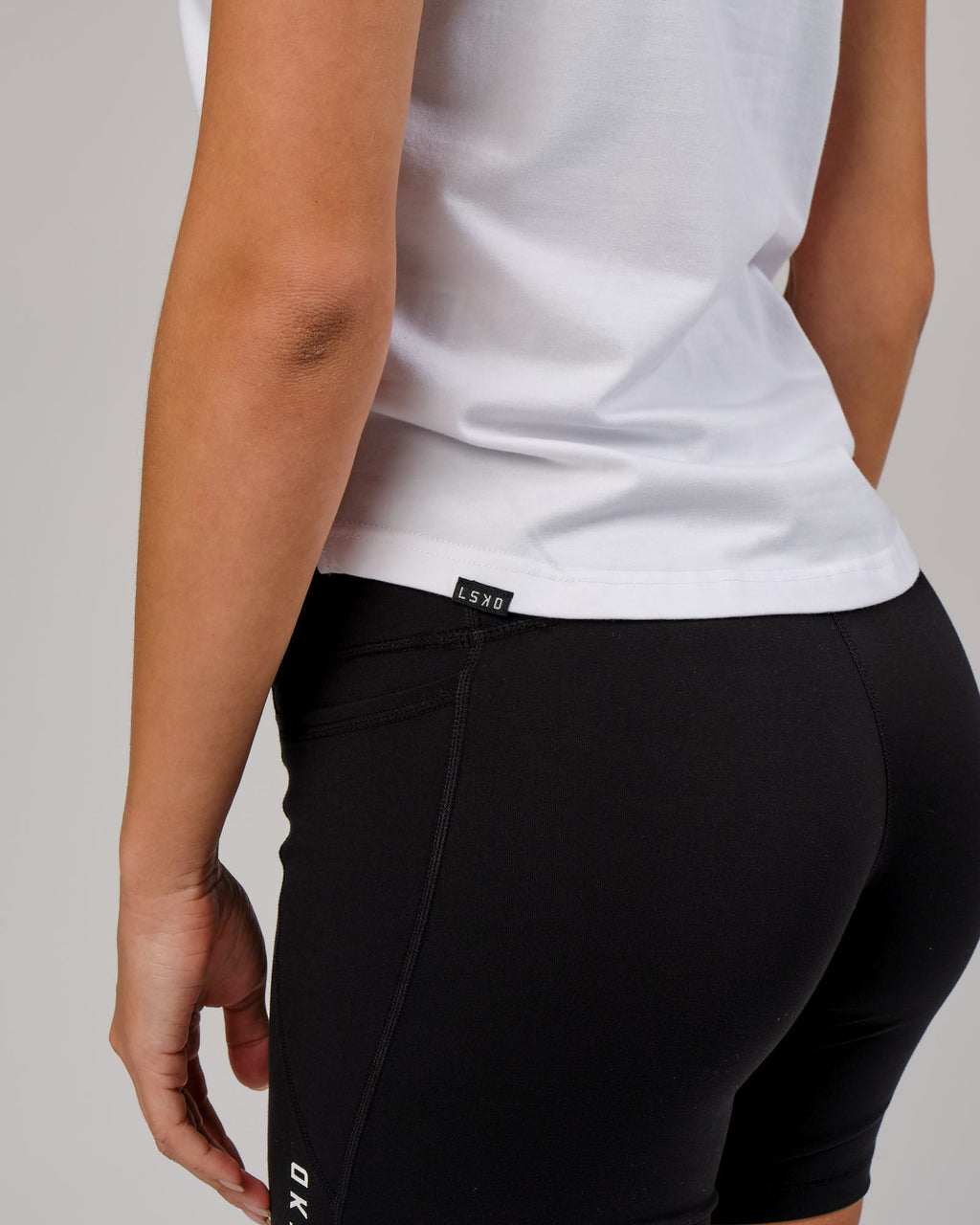 Model wearing Rep Tank - White-Nude