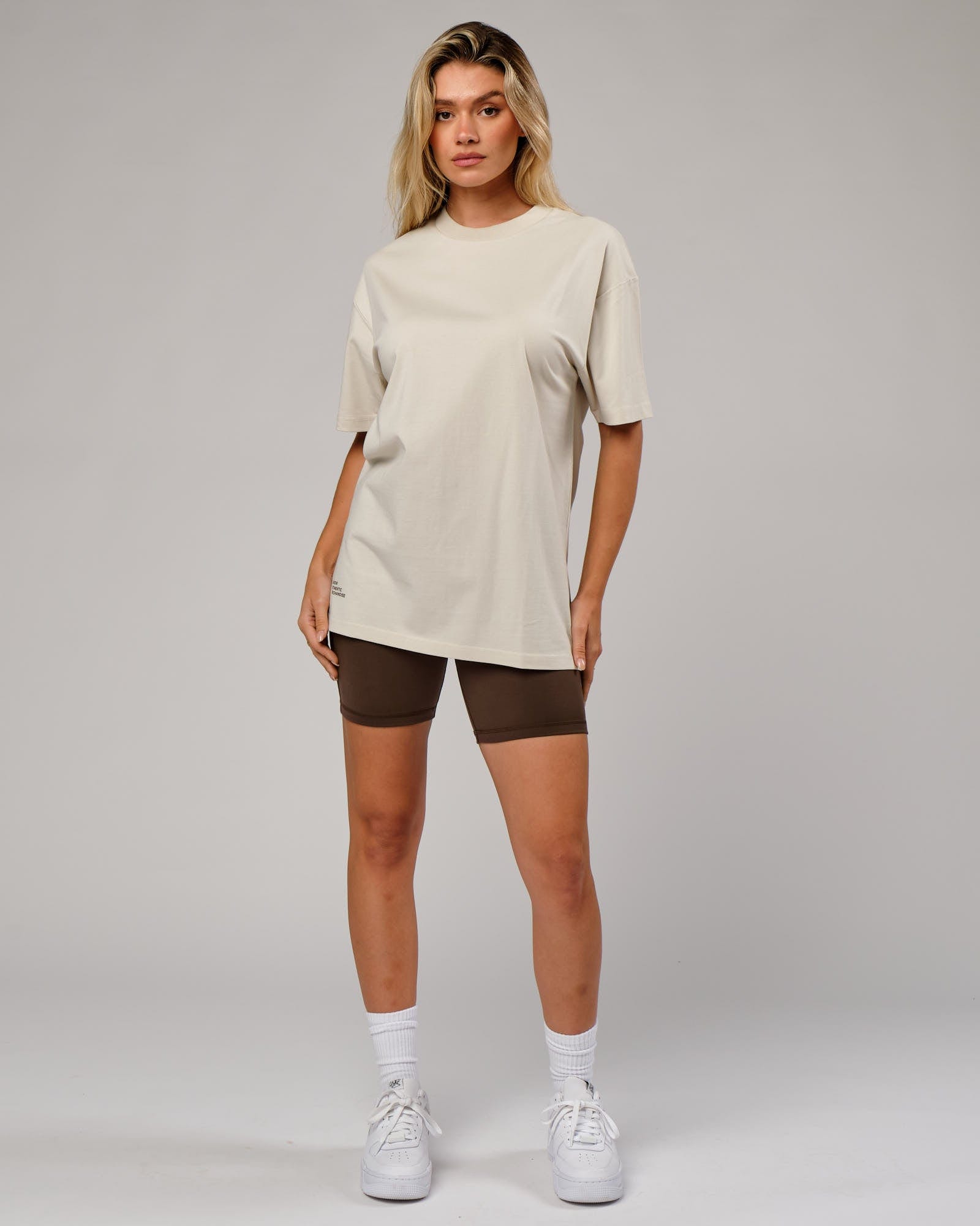 Model wearing Unisex OGTC Tee Oversize - Bone