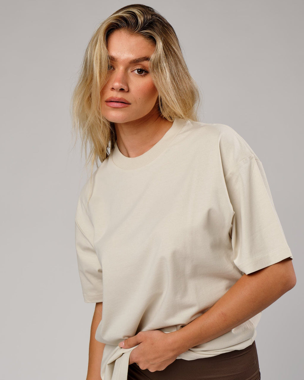 Model wearing Unisex OGTC Tee Oversize - Bone