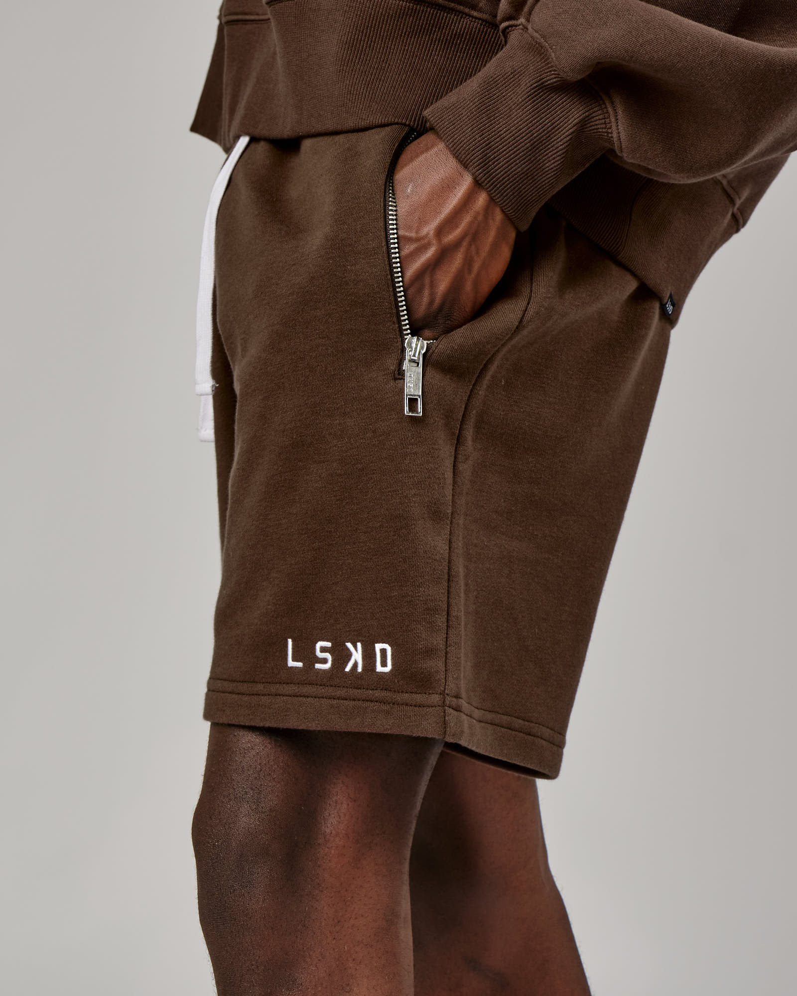 Model wearing Connor Track Short - Walnut