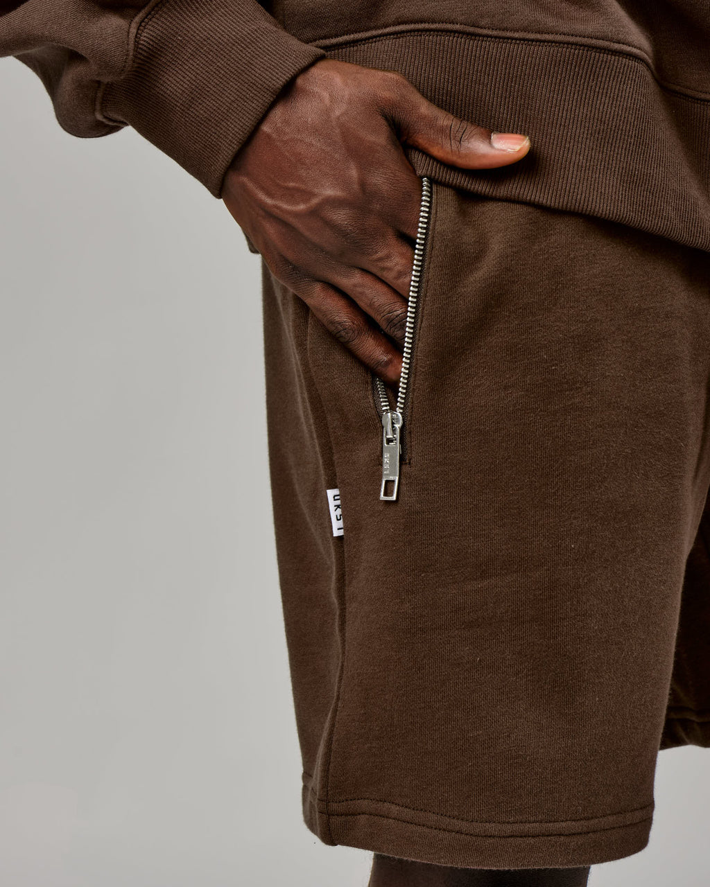 Model wearing Connor Track Short - Walnut