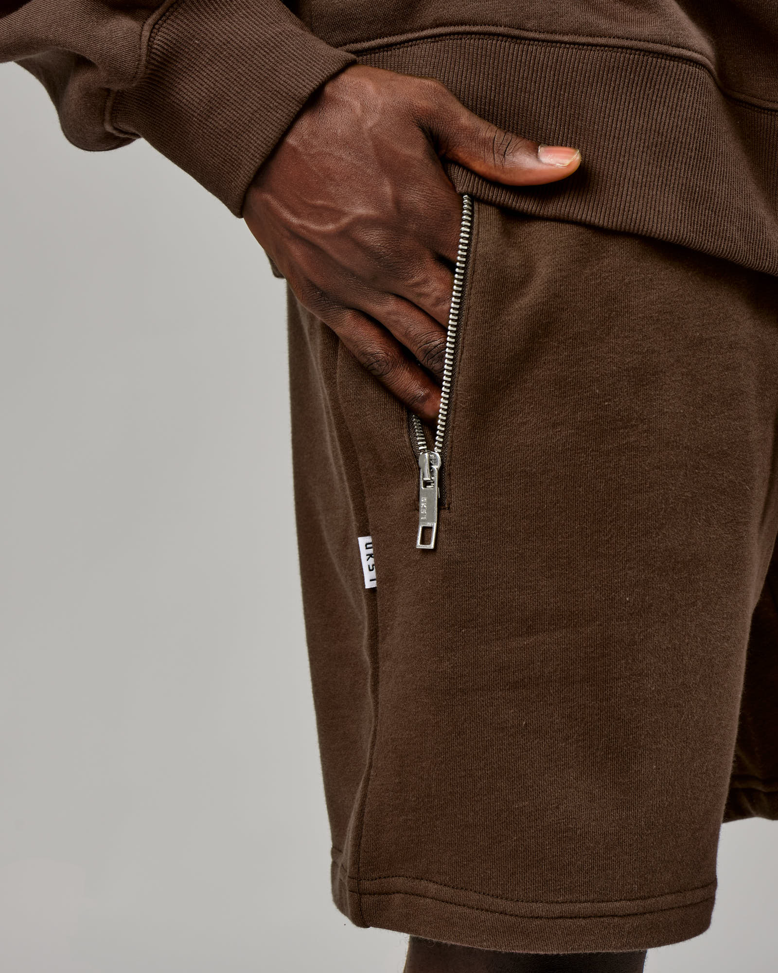 Model wearing Connor Track Short - Walnut