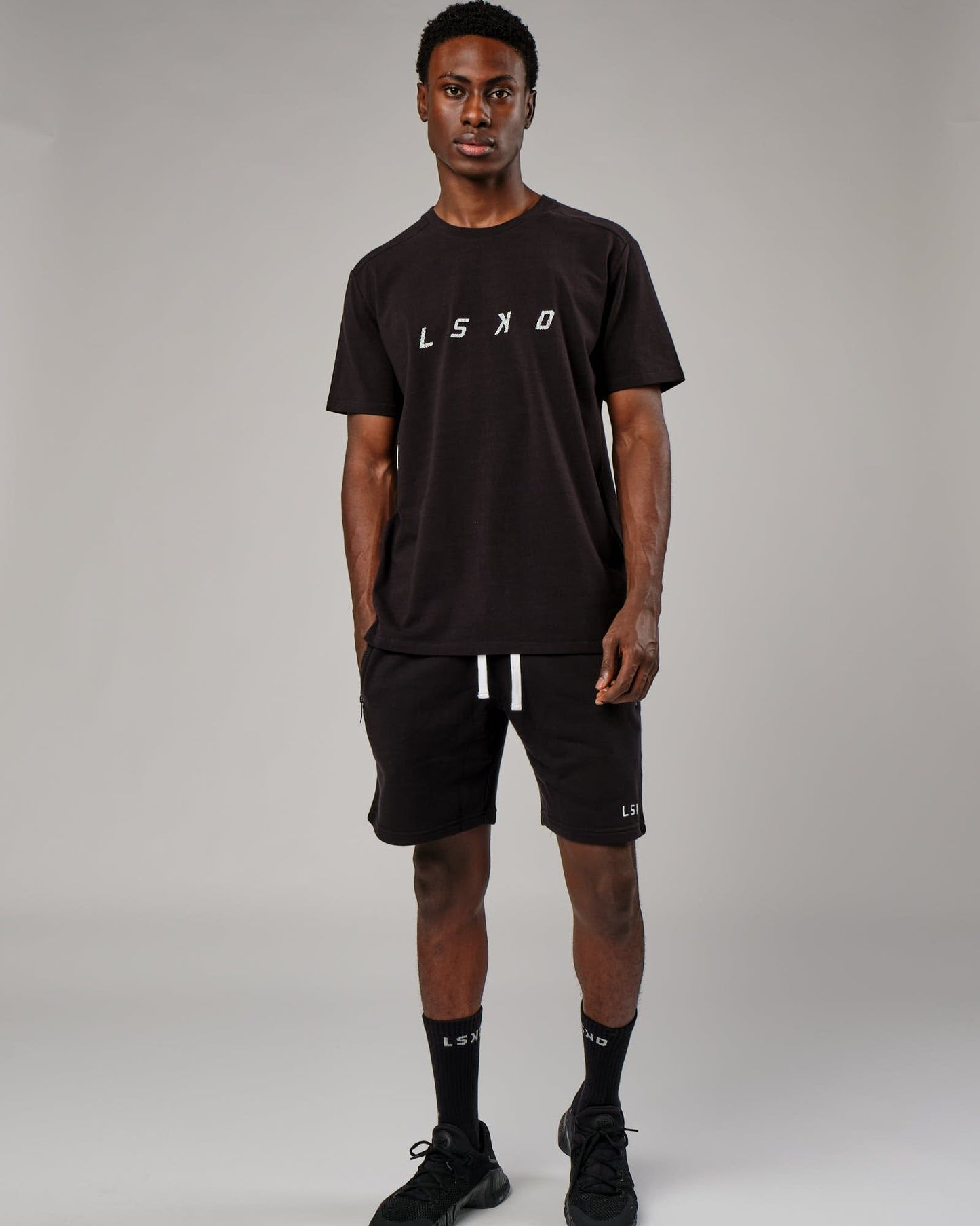 Model wearing Grid Tee - Black