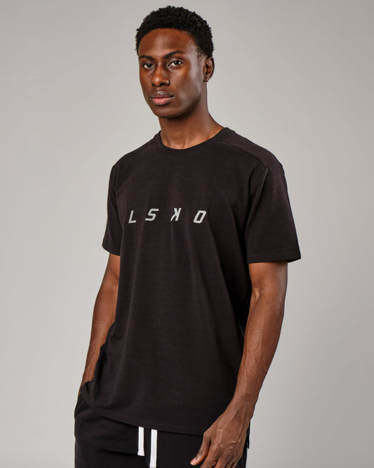 Model wearing Grid Tee - Black